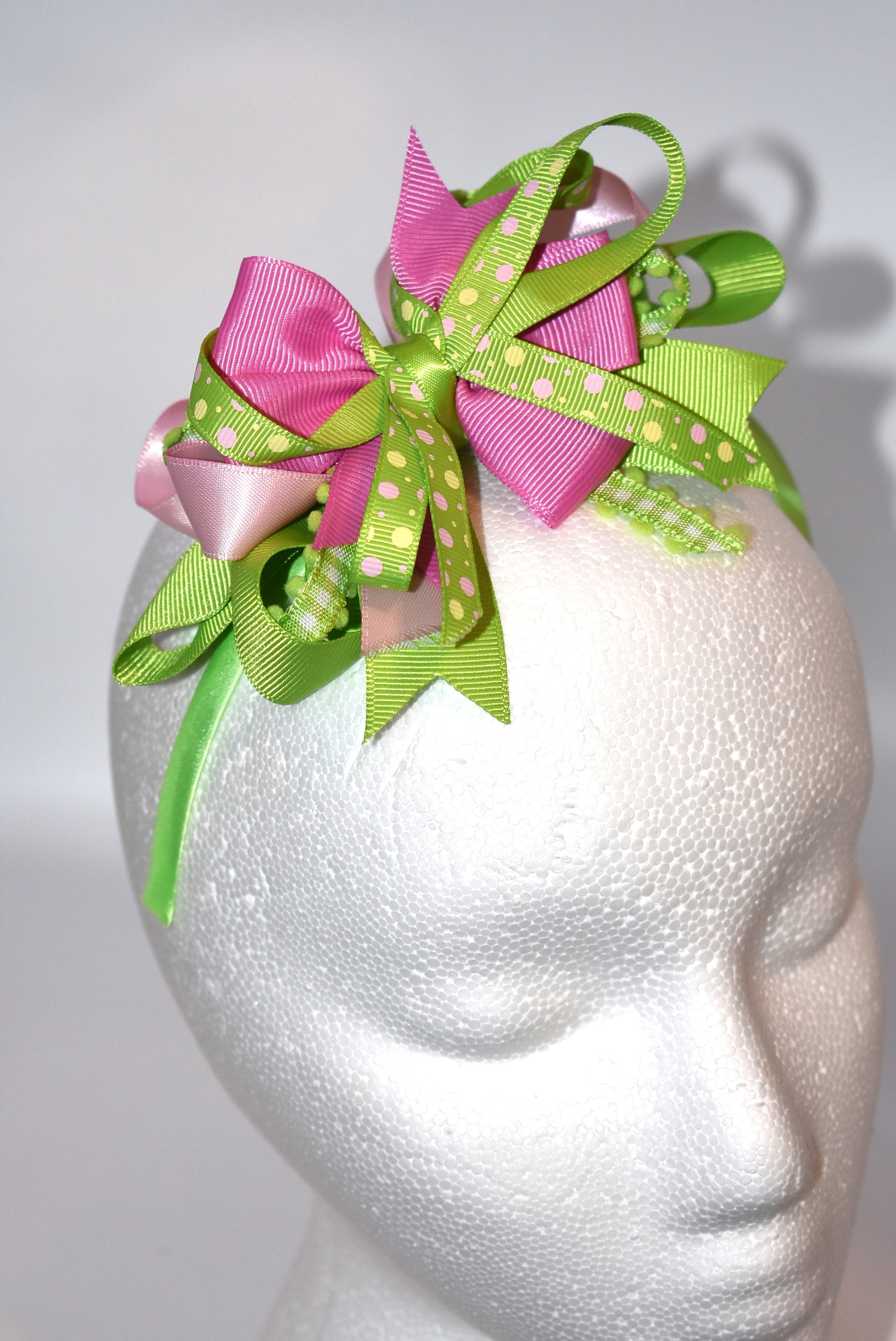 Wrap your hair in pure charm with this one-of-a-kind headband! ✨ Featuring delicate layers of pretty ribbon in a gorgeous green and pink color mix, this skinny satin headband is designed for all-day comfort and style. 🎀 Whether you're heading to work, running errands, or enjoying a casual day out, this beauty keeps your look polished without the fuss. 💚💗 Perfect for anyone who loves a pop of color and a touch of whimsy!