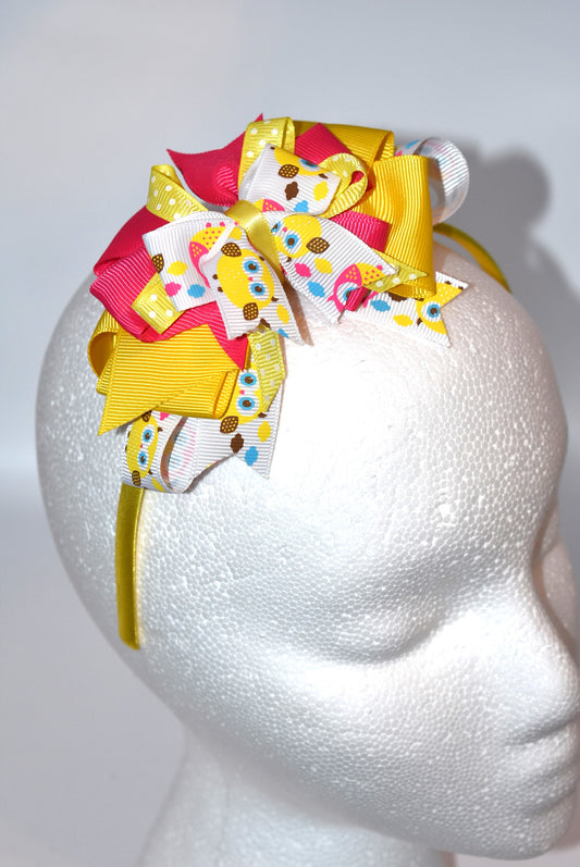 Hoot hoot! 🦉 This adorable satin-wrapped skinny headband is perfect for owl enthusiasts everywhere. Featuring a charming owl motif with pretty layers of pink and yellow ribbon, it's the ultimate accessory for adding a touch of whimsy to your look. The perfectly coordinated colors and soft satin finish make it both stylish and comfortable to wear all day long. Whether you're a devoted owl lover or just looking for something cute and quirky, this headband delivers charm in spades! 💛🩷