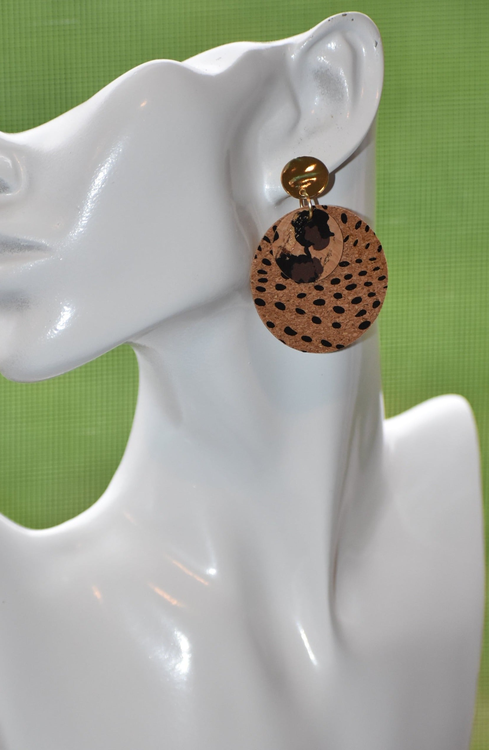 Walk on the wild side with these unique round cork leopard print earrings! Comfortably lightweight and crafted with a gold plated, hypoallergenic post, these are sure to make a statement without weighing you down! Ready for a roarin' good time? Jazz up any look with these wild accessories!