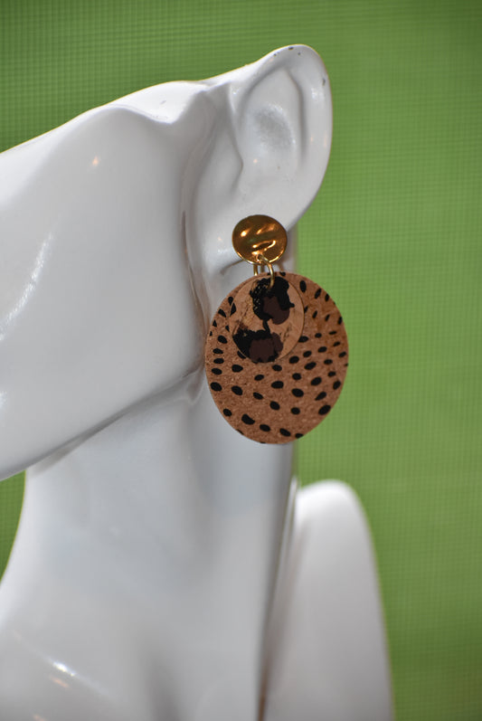 Walk on the wild side with these unique round cork leopard print earrings! Comfortably lightweight and crafted with a gold plated, hypoallergenic post, these are sure to make a statement without weighing you down! Ready for a roarin' good time? Jazz up any look with these wild accessories!