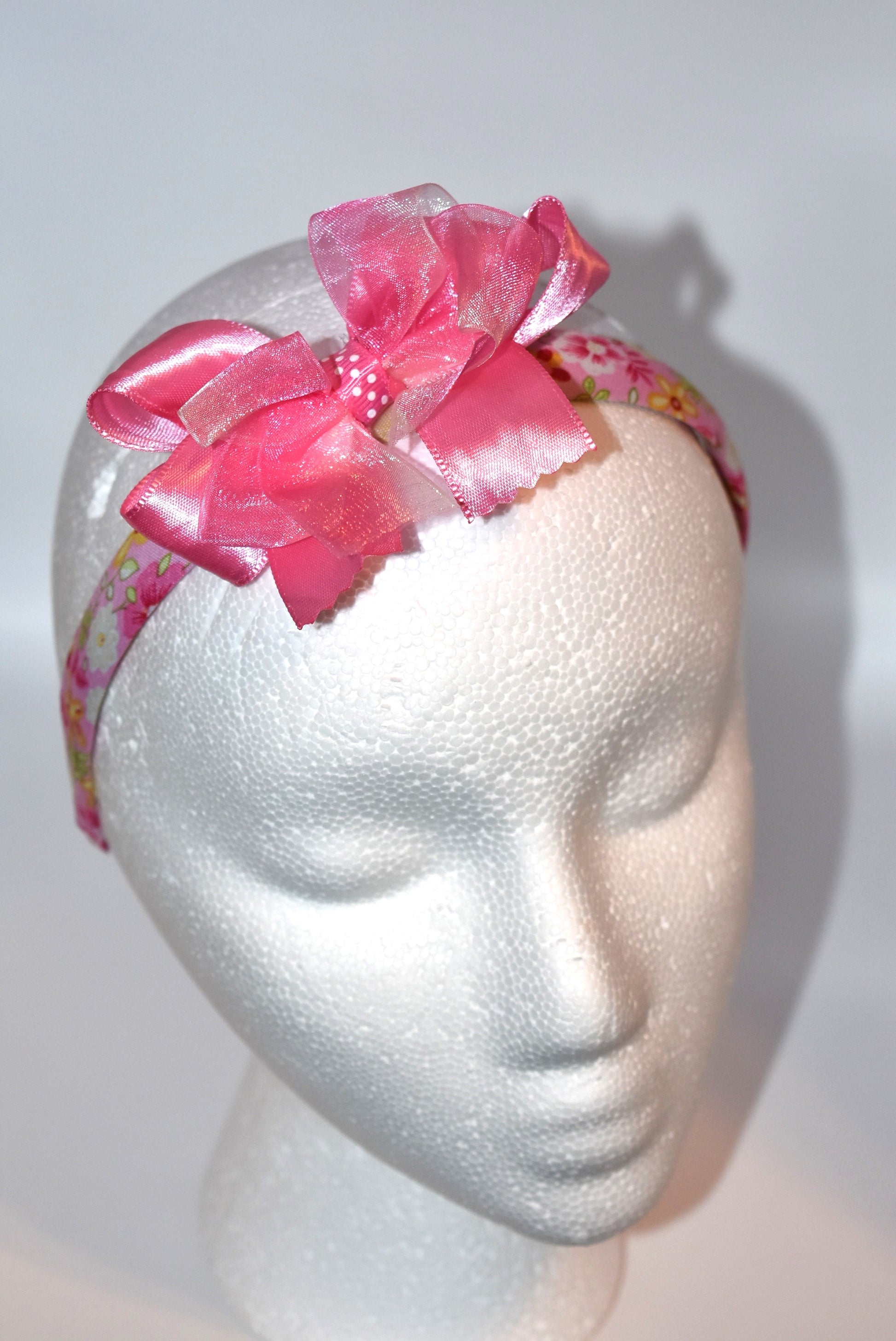 Blush in style with this adorable pink floral headband! 🌸 Perfect for pink lovers everywhere, this charming accessory features a delicate satin and chiffon bow perched on top for that extra touch of sweetness. 💕 Whether you're dressing up for a special occasion or adding a pop of color to your everyday look, this pretty headband brings instant elegance and fun to any outfit. ✨ Simple, stunning, and oh-so-feminine!