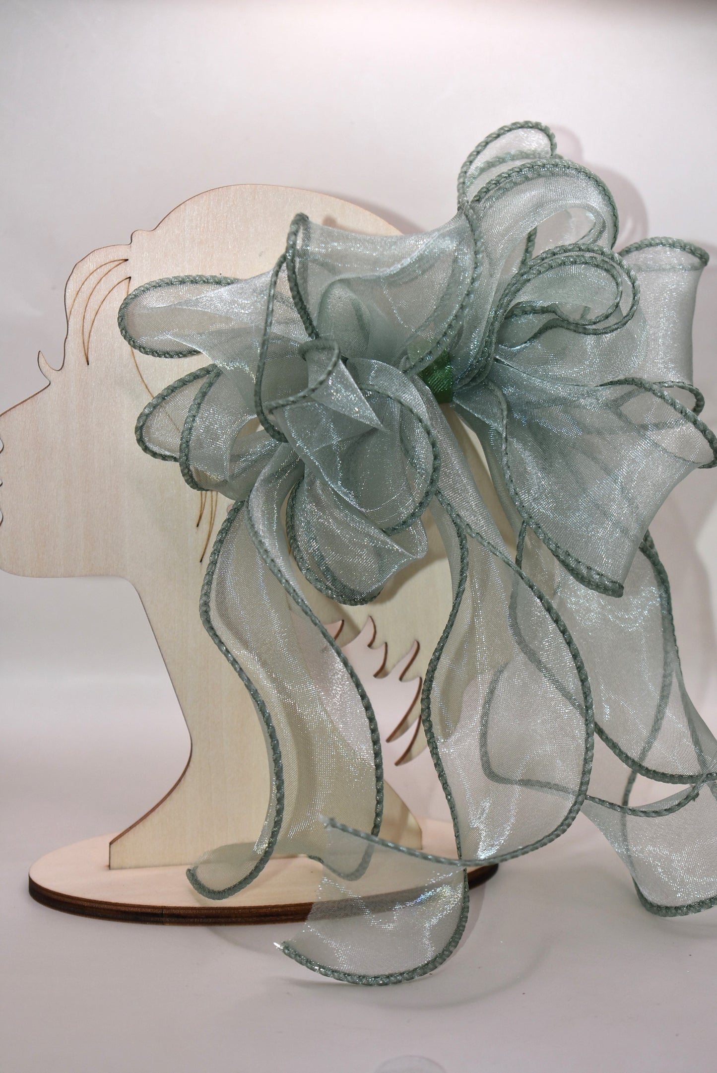 Add a touch of charm with this beautiful sage green long bow, crafted from layers of soft, flowing material. Featuring a wrapped alligator clip, it’s easy to wear and perfect for any age. Whether you’re dressing up or adding a playful twist to your everyday look, this bow brings style and fun wherever you go.