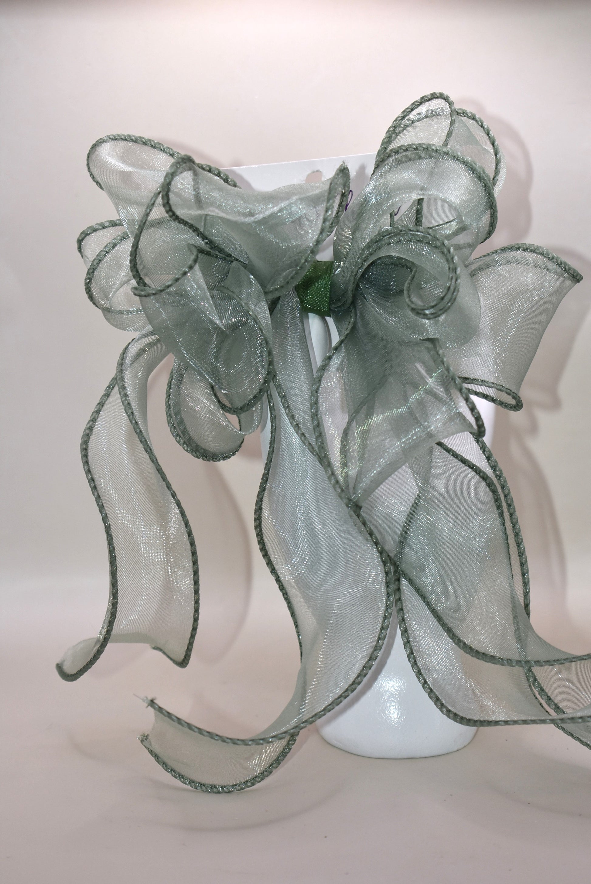 Add a touch of charm with this beautiful sage green long bow, crafted from layers of soft, flowing material. Featuring a wrapped alligator clip, it’s easy to wear and perfect for any age. Whether you’re dressing up or adding a playful twist to your everyday look, this bow brings style and fun wherever you go.
