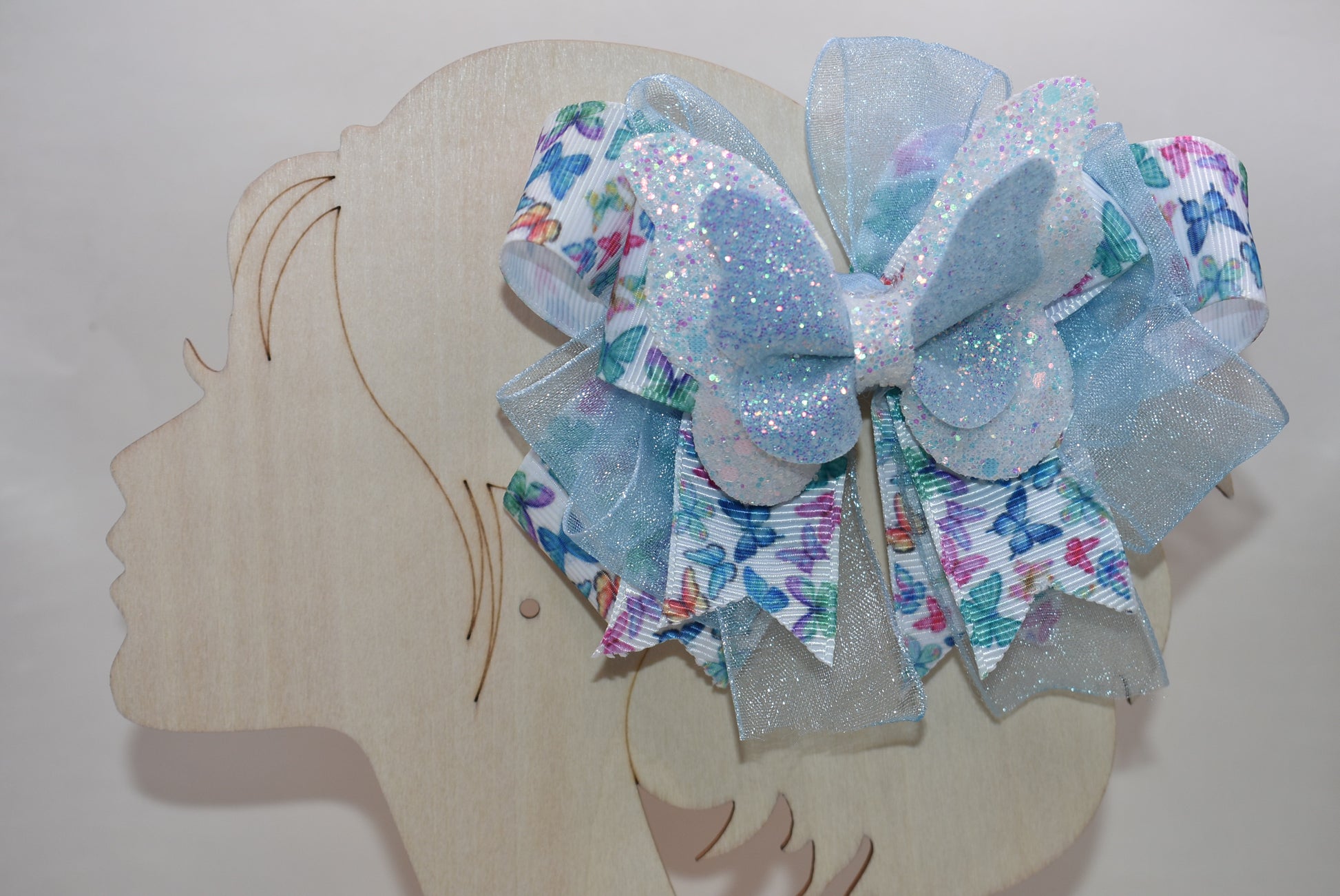 ✨ Introducing a whimsical accessory straight from Nana's Collection! This enchanting blue butterfly bow features delicate multi-colored ribbon details and luxurious layered fabric that catches the light beautifully. 🦋 The wrapped alligator clip makes it effortless to secure in your hair, keeping your style picture-perfect all day long. Perfect for adding a touch of charm and personality to any look! 💙🎀