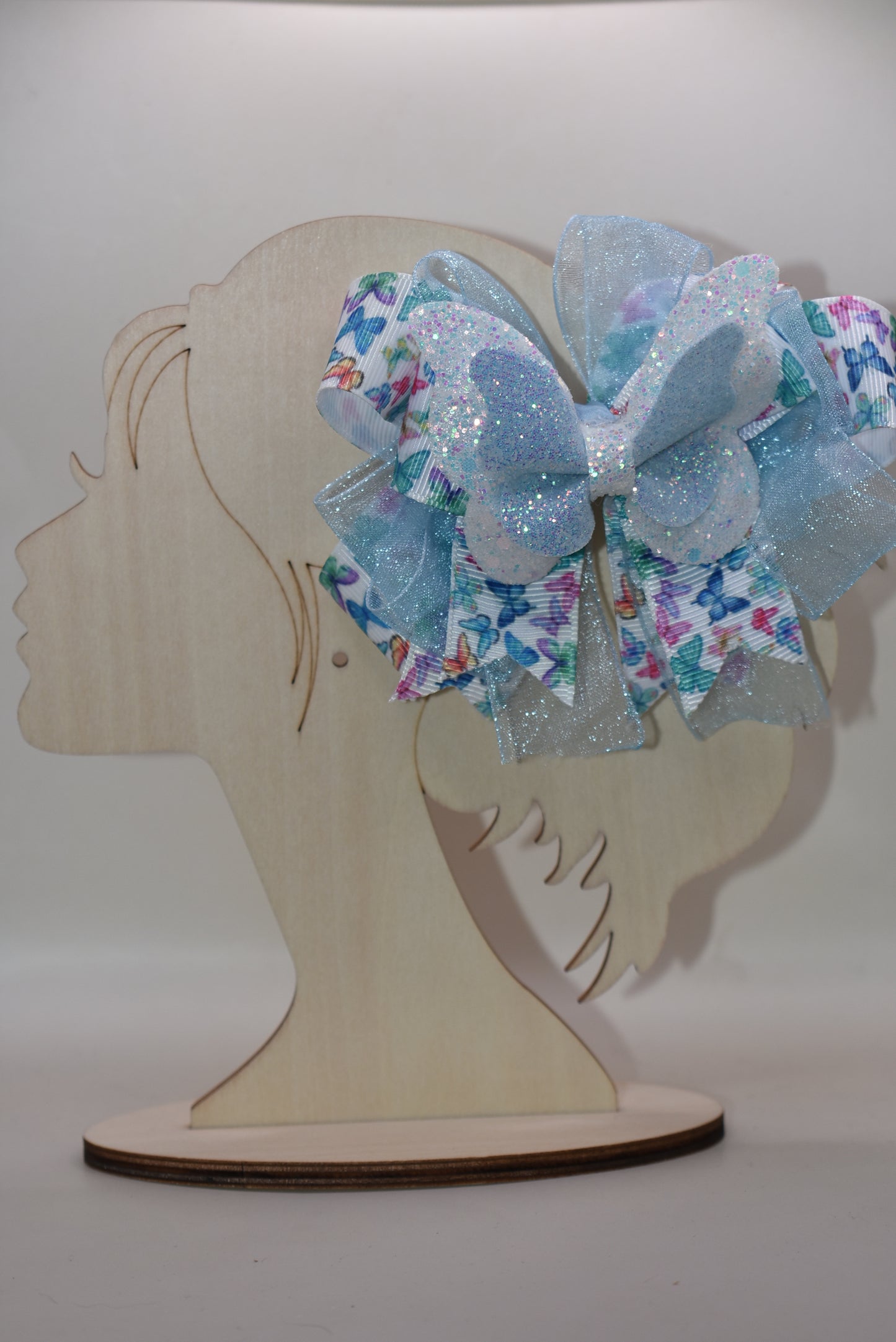 ✨ Introducing a whimsical accessory straight from Nana's Collection! This enchanting blue butterfly bow features delicate multi-colored ribbon details and luxurious layered fabric that catches the light beautifully. 🦋 The wrapped alligator clip makes it effortless to secure in your hair, keeping your style picture-perfect all day long. Perfect for adding a touch of charm and personality to any look! 💙🎀