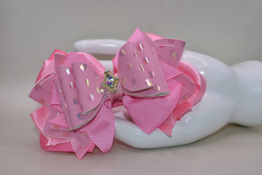 ✨ Introducing Nana's Collection – your new go-to accessory for all things pink and fabulous! 🎀 This charming hair clip features gorgeous layers of soft pink ribbon and faux leather that blend together beautifully, creating the perfect texture mix for any hairstyle. 💕 The wrapped alligator clip keeps your hair secure all day long, while a sparkling charm sits pretty on top, adding that extra touch of glamour. 🌟 Whether you're dressing up or keeping it casual, this sweet accessory brings playful elegance t