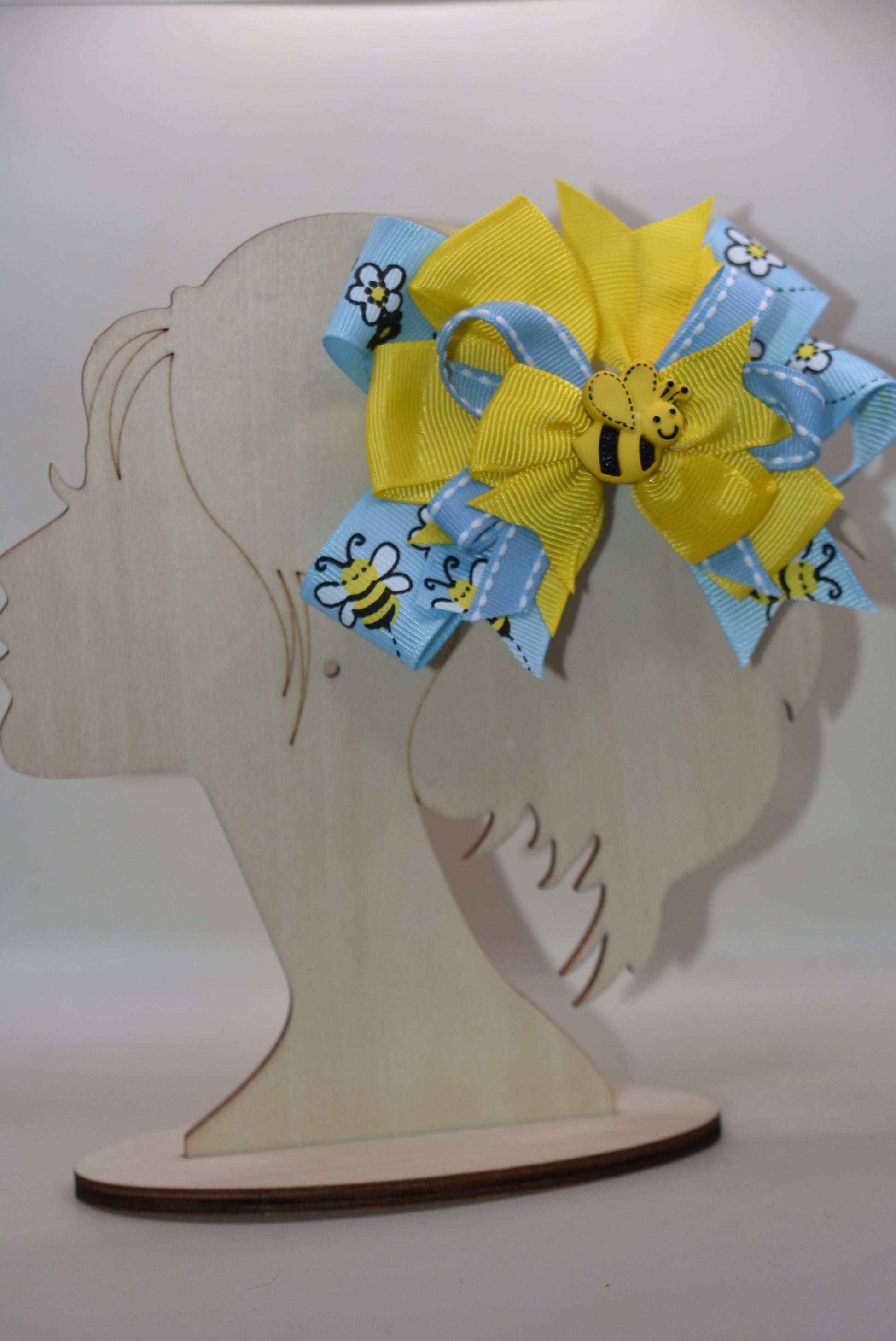 🐝 Introducing the sweetest addition to your little one's accessory collection! This adorable bumble bee bow features delightful layers of ribbon that create texture and charm. Perfect for adding a pop of personality to any outfit, from casual playdates to special occasions. Watch your child's face light up when they see this fun, buzzing accessory! 🎀✨ A playful must-have that brings joy and style together.