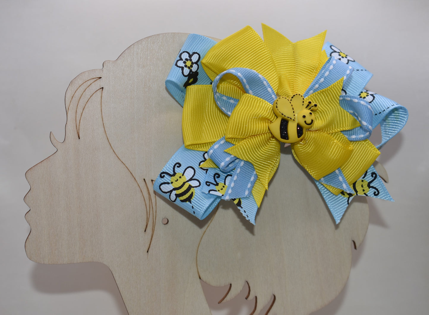 🐝 Introducing the sweetest addition to your little one's accessory collection! This adorable bumble bee bow features delightful layers of ribbon that create texture and charm. Perfect for adding a pop of personality to any outfit, from casual playdates to special occasions. Watch your child's face light up when they see this fun, buzzing accessory! 🎀✨ A playful must-have that brings joy and style together.
