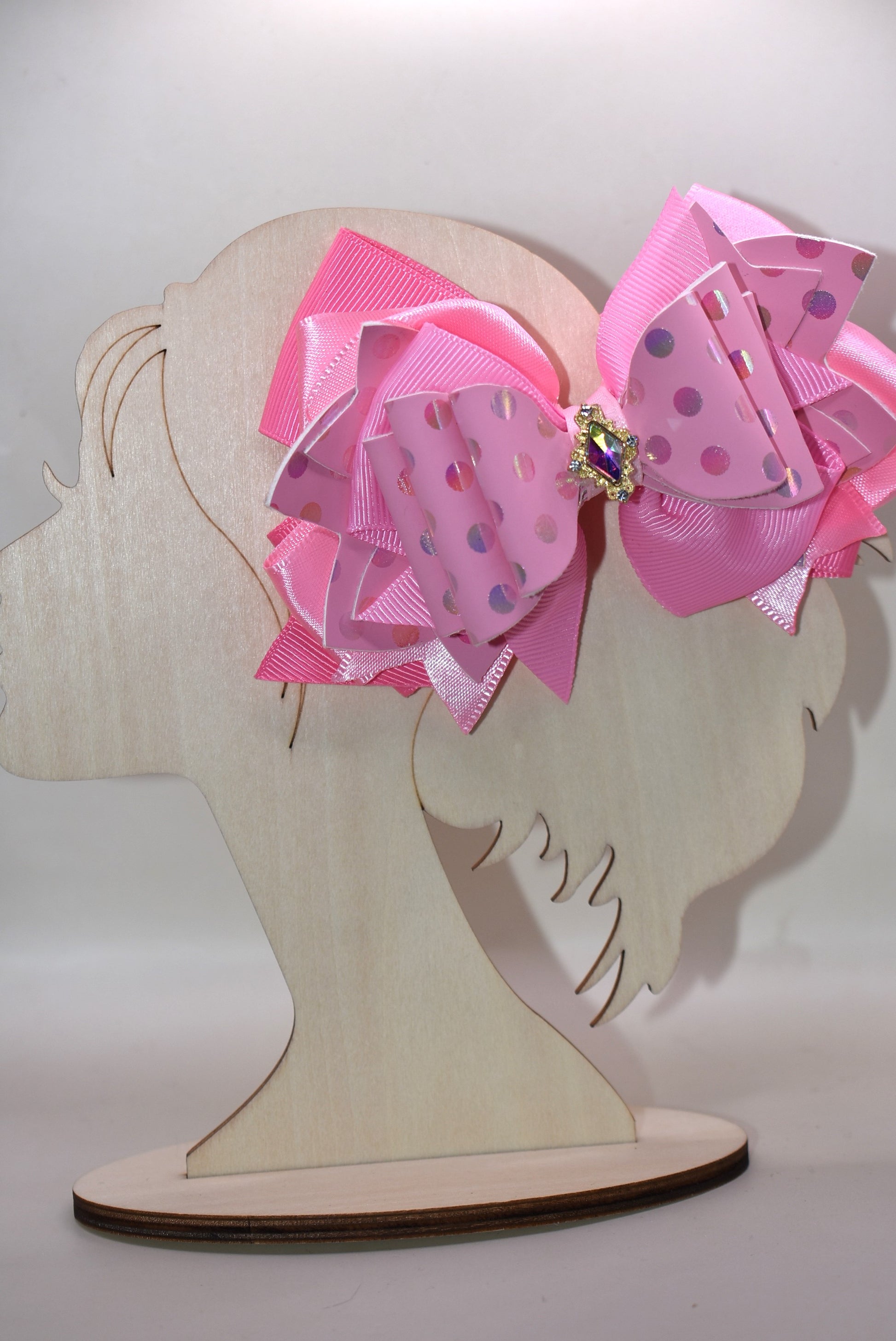 ✨ Introducing Nana's Collection – your new go-to accessory for all things pink and fabulous! 🎀 This charming hair clip features gorgeous layers of soft pink ribbon and faux leather that blend together beautifully, creating the perfect texture mix for any hairstyle. 💕 The wrapped alligator clip keeps your hair secure all day long, while a sparkling charm sits pretty on top, adding that extra touch of glamour. 🌟 Whether you're dressing up or keeping it casual, this sweet accessory brings playful elegance t