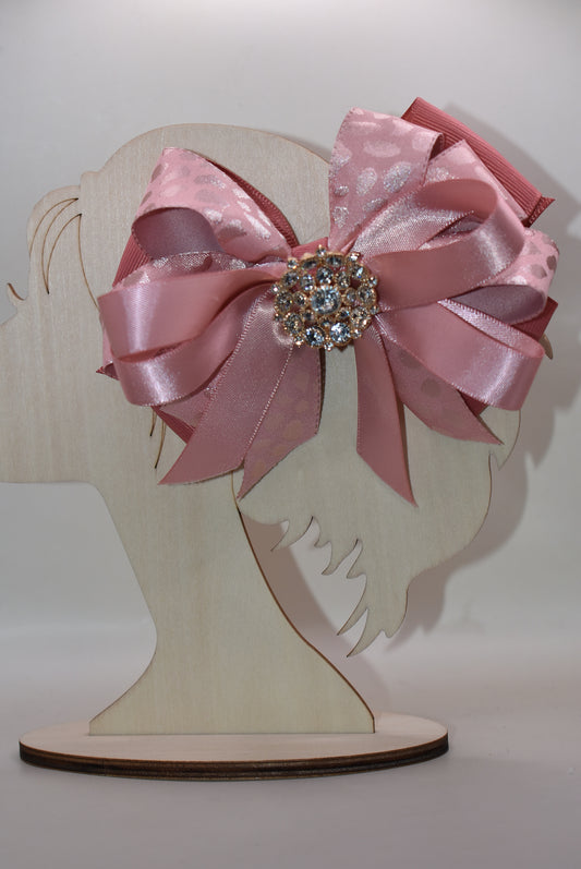 ✨ Elevate your hair game with this stunning satin ribbon clip! Luxuriously soft layers of beautiful satin create an elegant foundation, while a sparkling crystal charm sits pretty on top for that extra touch of glamour. 💎 The wrapped alligator clip ensures a secure, comfortable hold that lasts all day long. Perfect for adding a dash of sophistication to any look! 🎀