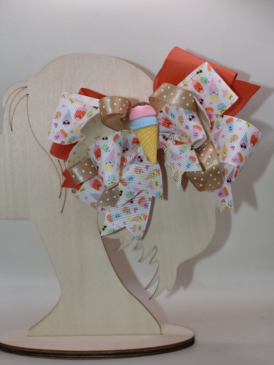 Scoop up the sweetness! 🍦 This delightful bow features layers of fun ice cream ribbon that'll make any hairstyle extra special. ✨ Topped with an adorable ice cream charm, it's the perfect playful accessory for adding a sprinkle of joy to your everyday look. 🎀 Whether you're heading to school, a party, or just want to brighten your day, this charming bow brings the fun wherever you go! 🌈
