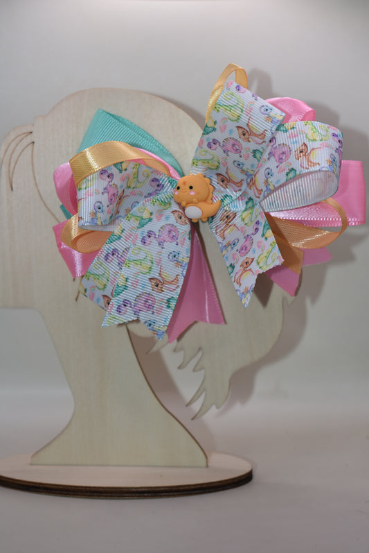 🦕 Roar into style with this absolutely adorable dinosaur charm! This cute little dino is tied up in a pretty multicolored ribbon bow that's ready to add a splash of fun to any outfit. Whether you're a dinosaur enthusiast or just love quirky accessories, this playful piece from Nana's Collection is the perfect way to show off your wild side. 🎀✨ Attach it to your favorite bag, keychain, or outfit for an instant charm boost that'll have everyone asking where you found such a delightful treasure!