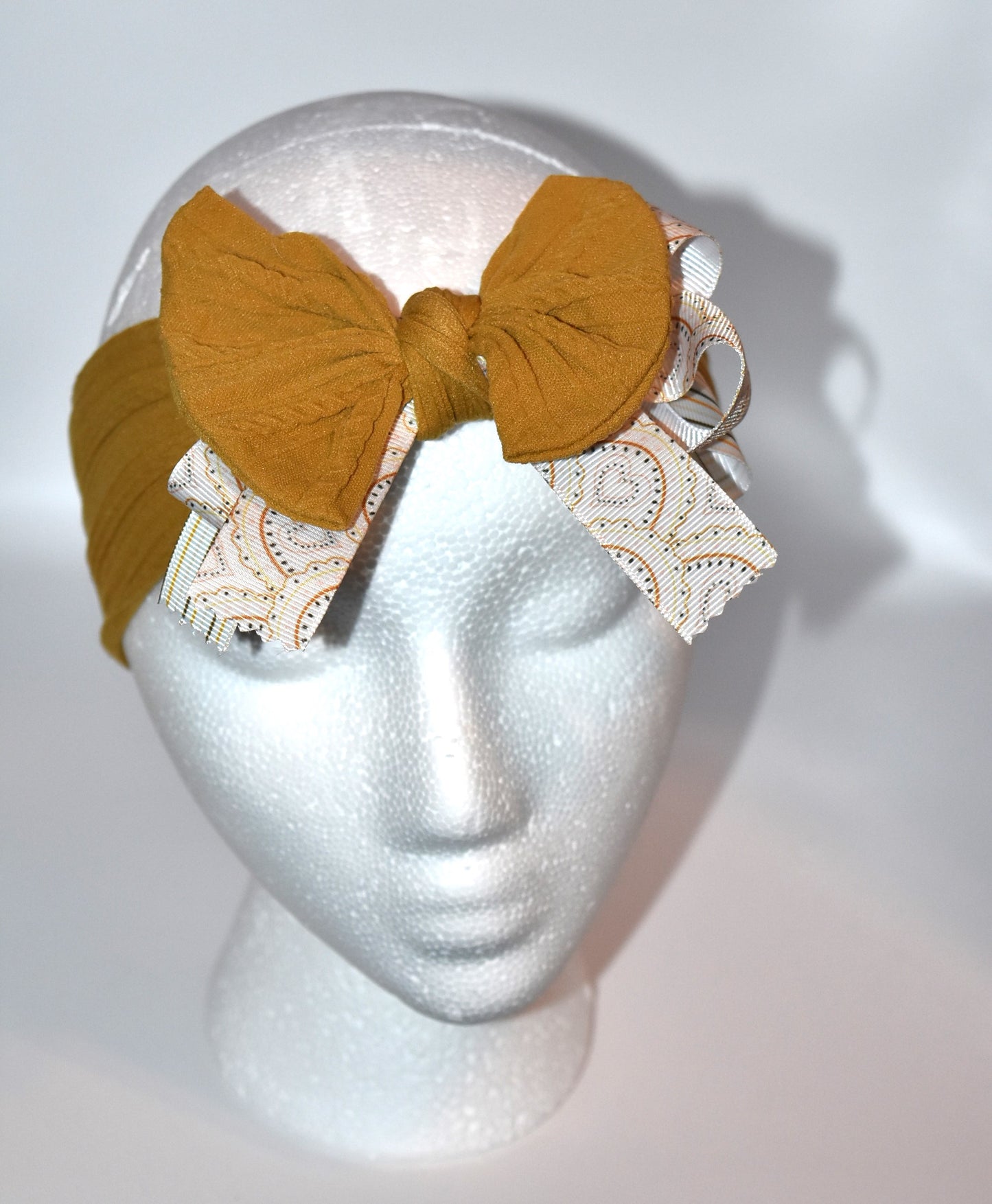 Add a touch of charm with this soft brown headband 🎀 featuring layered striped and heart ribbons for a fun, dimensional look. Cozy and comfy, it’s perfect for all ages to wear and play! 🌟