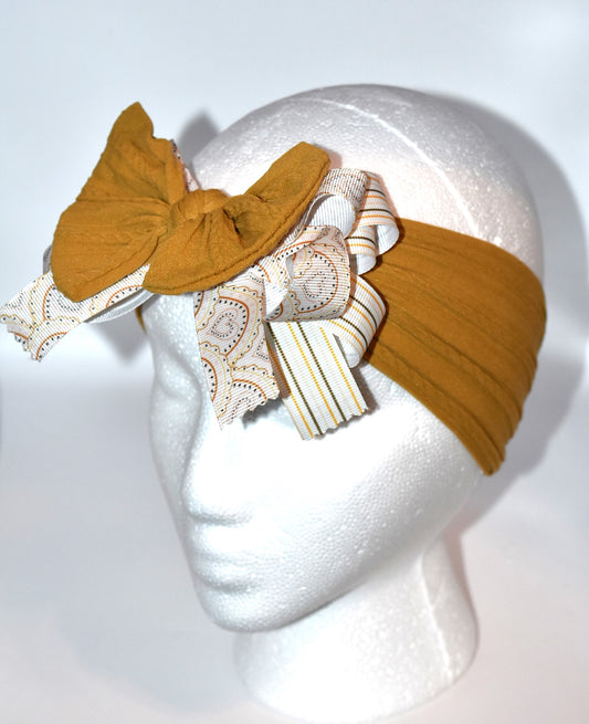 Add a touch of charm with this soft brown headband 🎀 featuring layered striped and heart ribbons for a fun, dimensional look. Cozy and comfy, it’s perfect for all ages to wear and play! 🌟