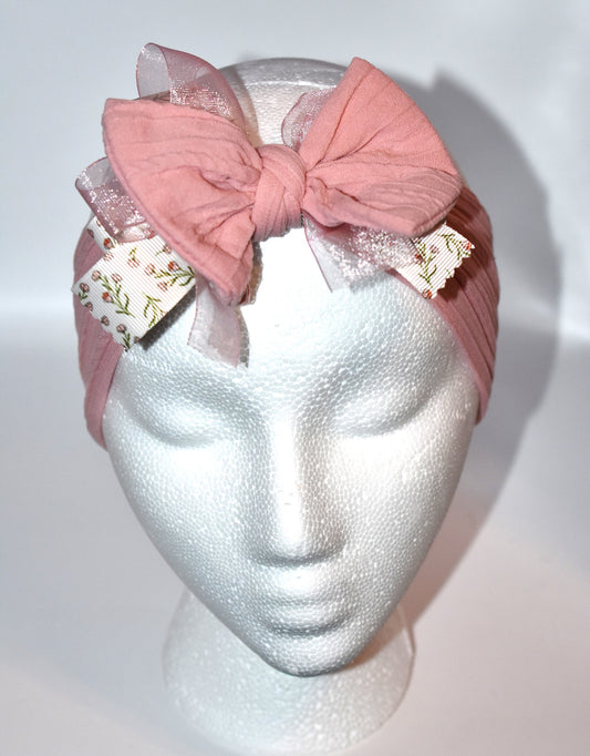 Add a touch of sweetness with this soft blush pink headband, featuring a delicate floral ribbon centerpiece and a gentle baby pink chiffon accent. It's the perfect playful accessory for all ages to brighten up any outfit with a soft, pretty vibe. 🌸🎀💕