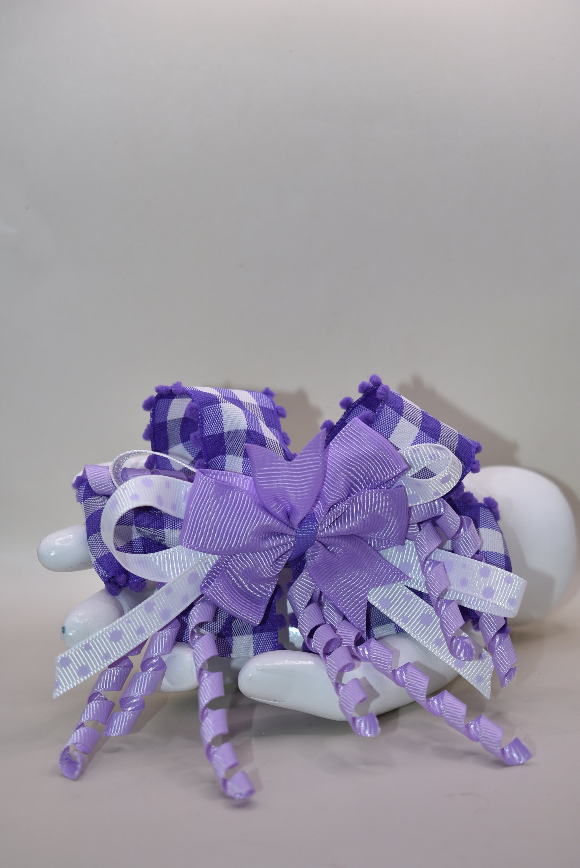 ✨ Add a pop of purple pizzazz to any hairstyle with this adorable layered bow! 🎀 Featuring streaming ribbons that twirl and dance with every movement, it's as fun to wear as it is to look at. The wrapped alligator clip keeps everything secure and comfy all day long, so your little one can play, twirl, and have a blast without a care. 💜 Perfect for everyday cuteness or special occasions! 🌈