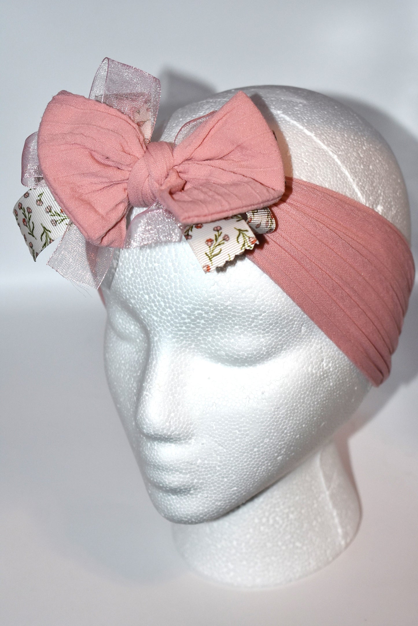 Add a touch of sweetness with this soft blush pink headband, featuring a delicate floral ribbon centerpiece and a gentle baby pink chiffon accent. It's the perfect playful accessory for all ages to brighten up any outfit with a soft, pretty vibe. 🌸🎀💕