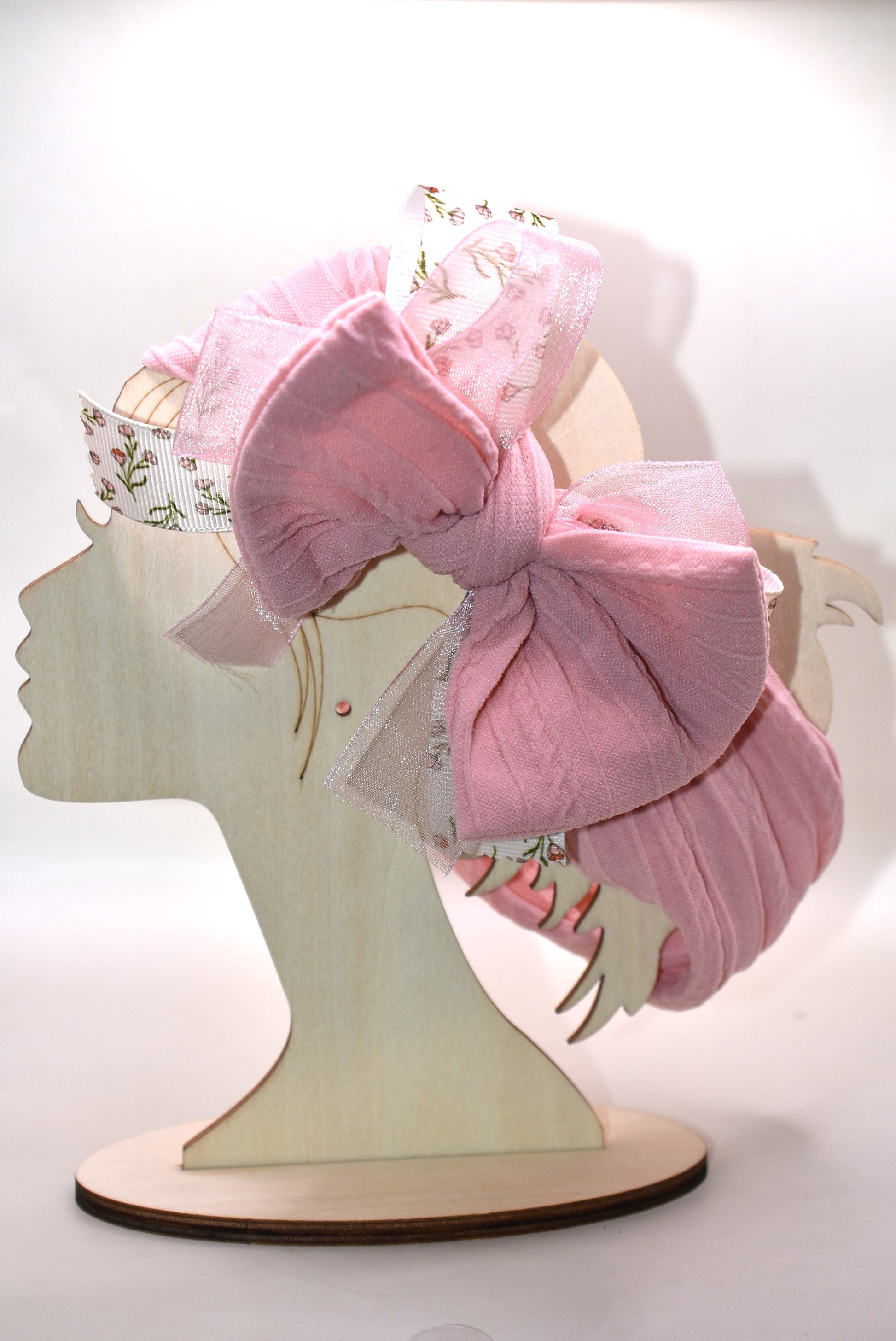 Add a touch of sweetness with this soft blush pink headband, featuring a delicate floral ribbon centerpiece and a gentle baby pink chiffon accent. It's the perfect playful accessory for all ages to brighten up any outfit with a soft, pretty vibe. 🌸🎀💕