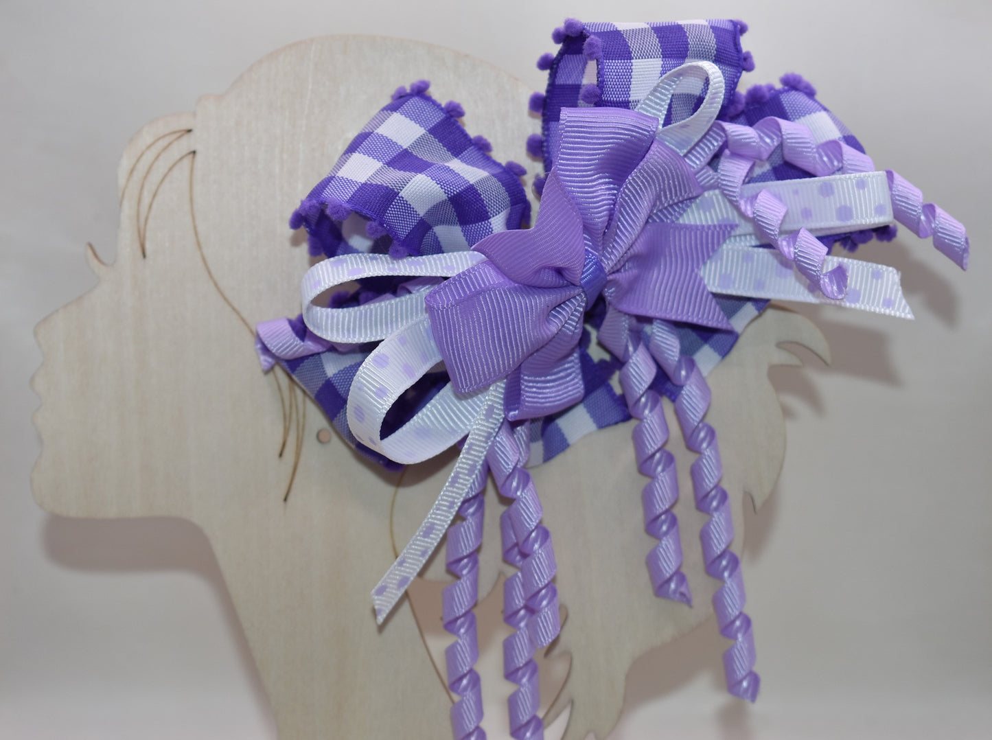 ✨ Add a pop of purple pizzazz to any hairstyle with this adorable layered bow! 🎀 Featuring streaming ribbons that twirl and dance with every movement, it's as fun to wear as it is to look at. The wrapped alligator clip keeps everything secure and comfy all day long, so your little one can play, twirl, and have a blast without a care. 💜 Perfect for everyday cuteness or special occasions! 🌈