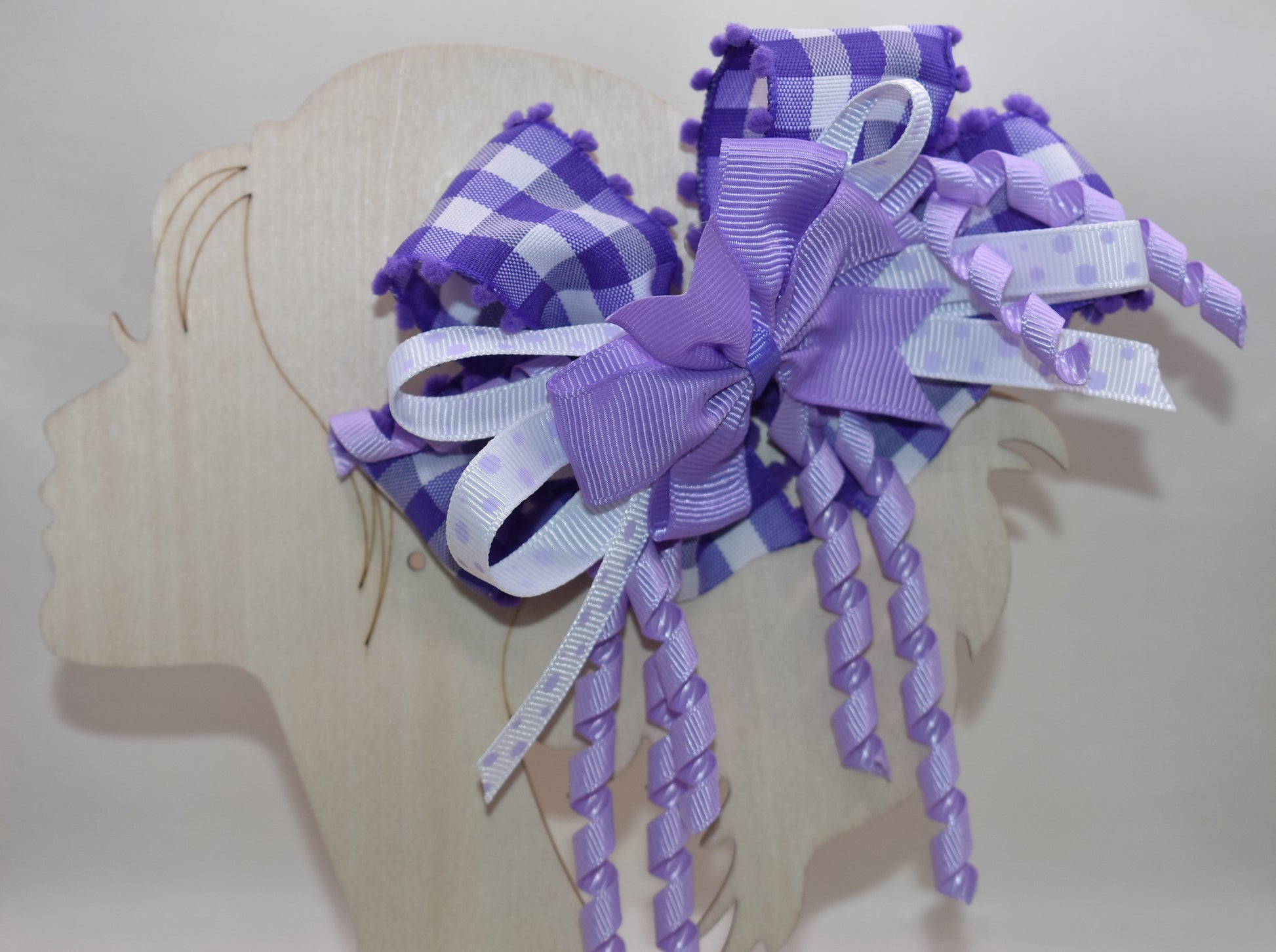 ✨ Add a pop of purple pizzazz to any hairstyle with this adorable layered bow! 🎀 Featuring streaming ribbons that twirl and dance with every movement, it's as fun to wear as it is to look at. The wrapped alligator clip keeps everything secure and comfy all day long, so your little one can play, twirl, and have a blast without a care. 💜 Perfect for everyday cuteness or special occasions! 🌈
