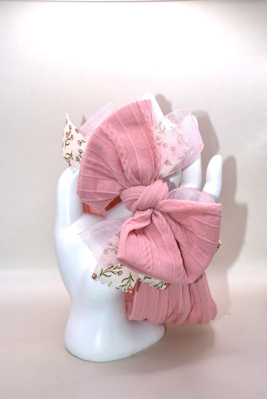 Add a touch of sweetness with this soft blush pink headband, featuring a delicate floral ribbon centerpiece and a gentle baby pink chiffon accent. It's the perfect playful accessory for all ages to brighten up any outfit with a soft, pretty vibe. 🌸🎀💕