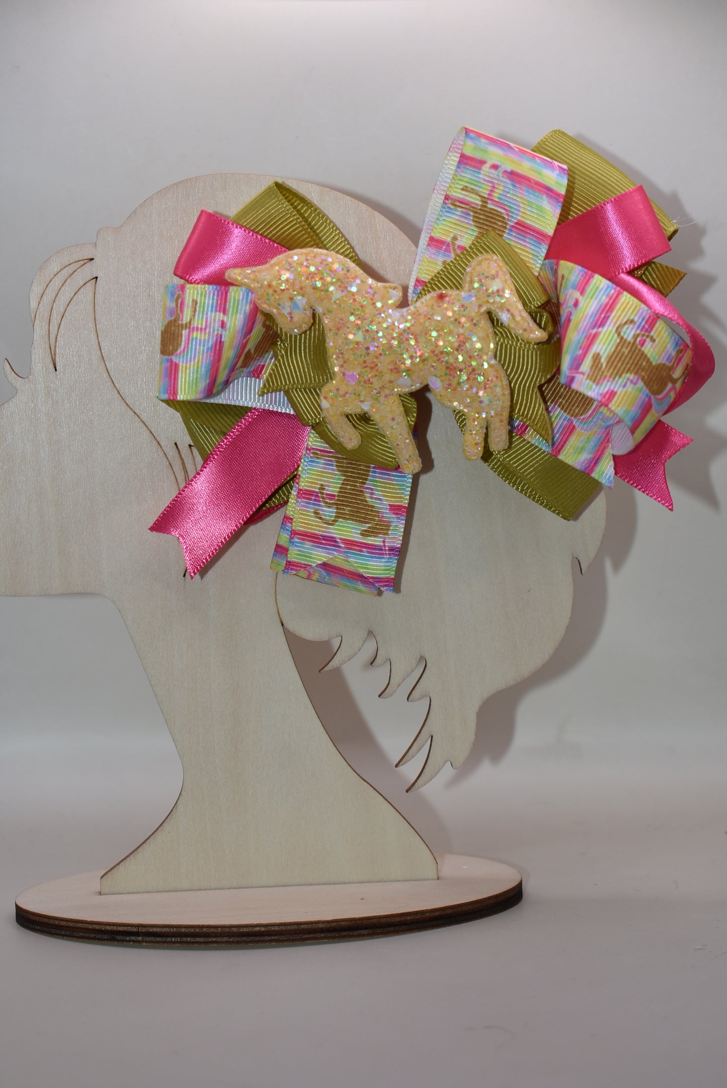 ✨ Get ready to turn heads with this absolutely magical unicorn bow! 🦄 Featuring an adorable, eye-catching gold unicorn patch perched on top of layered ribbon, this bow is pure fun and flair. The wrapped alligator clip makes it super easy to clip in and go—no fussing required! 💛 Perfect for adding a touch of whimsy and sparkle to any hairstyle. Whether you're heading to a party or just want to brighten your day, this playful accessory delivers instant charm and personality. 🎀