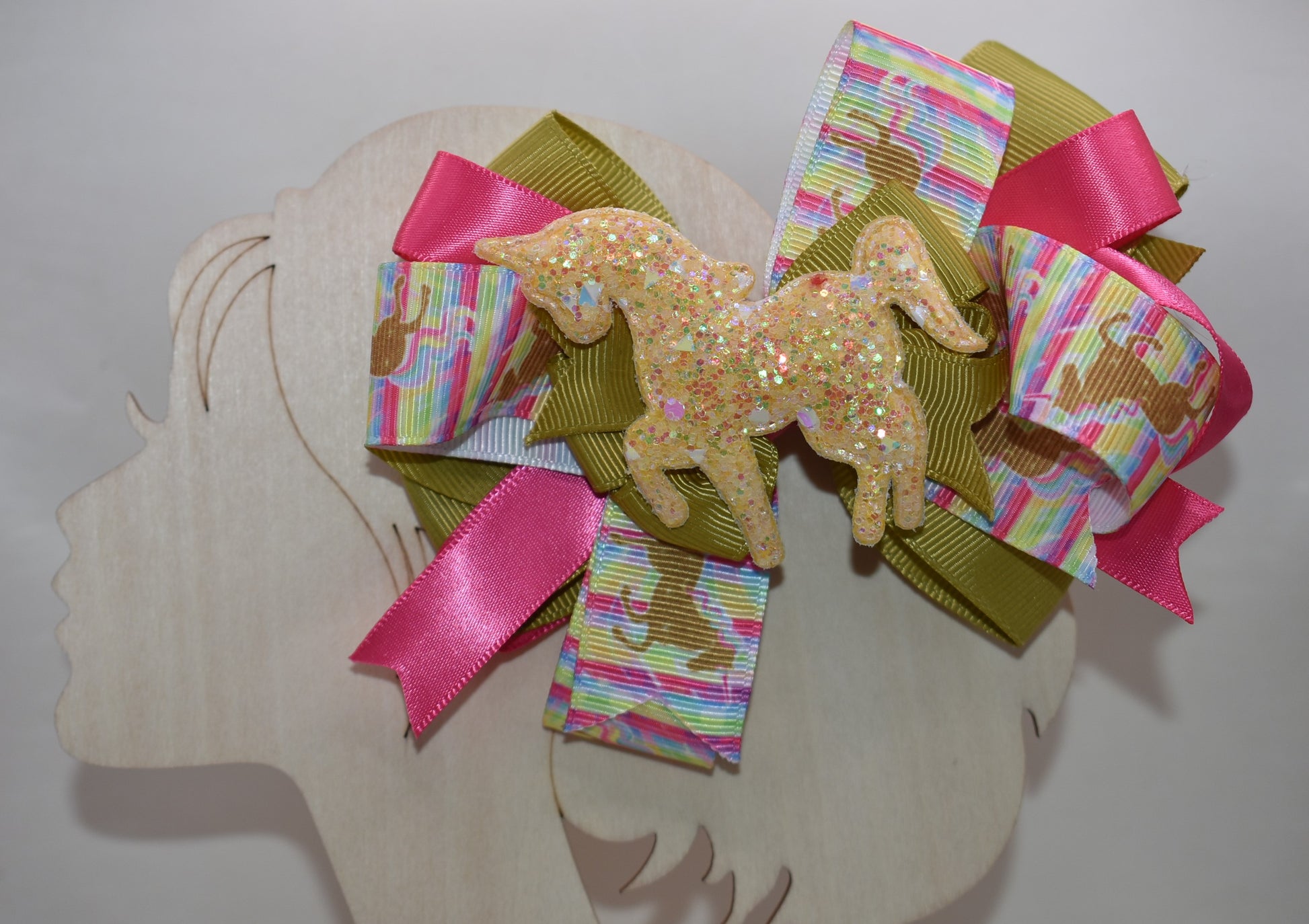 ✨ Get ready to turn heads with this absolutely magical unicorn bow! 🦄 Featuring an adorable, eye-catching gold unicorn patch perched on top of layered ribbon, this bow is pure fun and flair. The wrapped alligator clip makes it super easy to clip in and go—no fussing required! 💛 Perfect for adding a touch of whimsy and sparkle to any hairstyle. Whether you're heading to a party or just want to brighten your day, this playful accessory delivers instant charm and personality. 🎀
