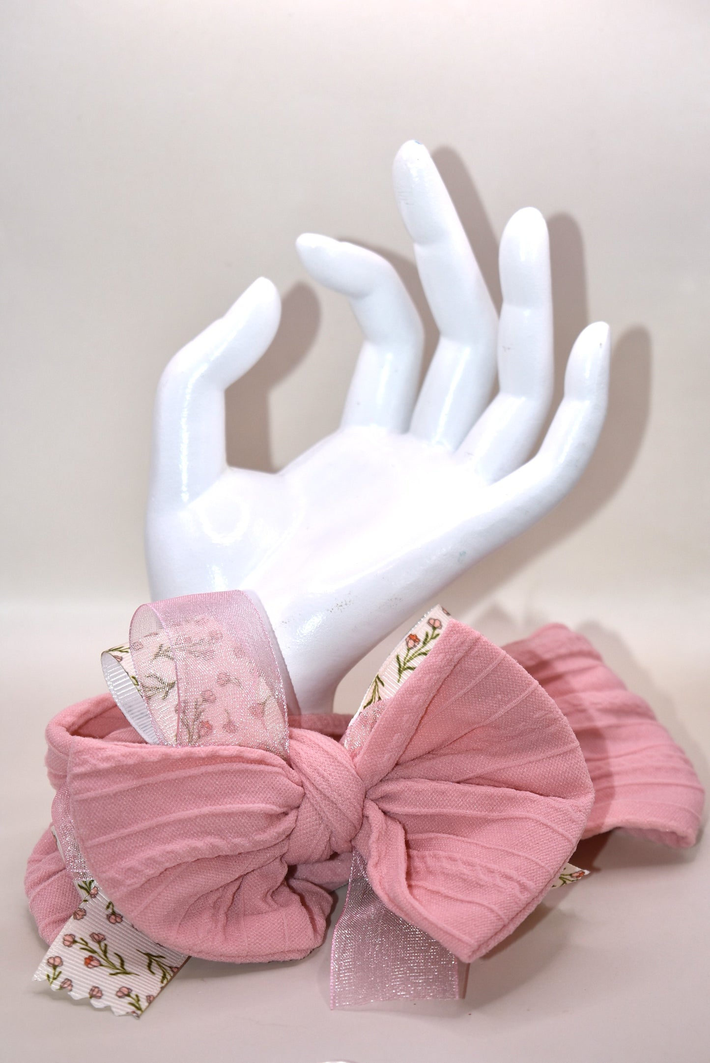 Add a touch of sweetness with this soft blush pink headband, featuring a delicate floral ribbon centerpiece and a gentle baby pink chiffon accent. It's the perfect playful accessory for all ages to brighten up any outfit with a soft, pretty vibe. 🌸🎀💕