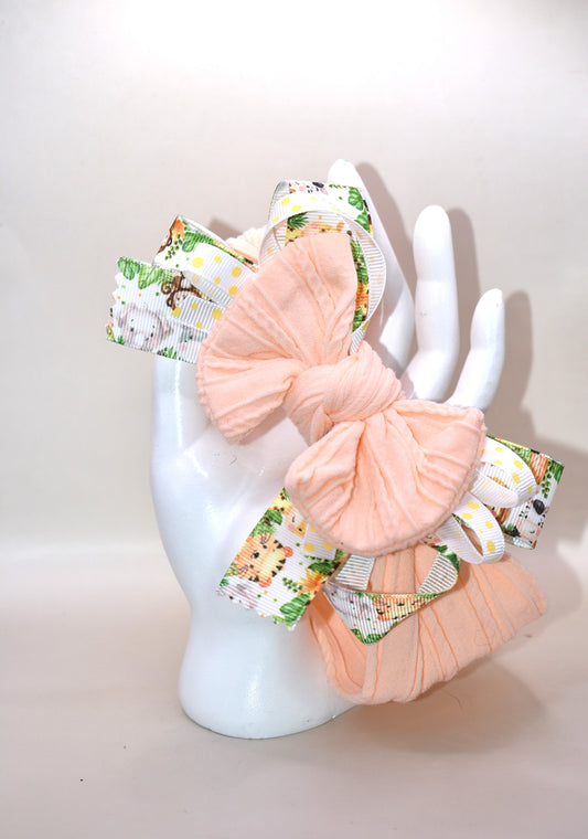 Add a splash of fun to your look with this wrapped headband featuring a super cute animal print ribbon blended with soft peach fabric. This one-of-a-kind piece is perfect for brightening your day and keeping hair stylishly in place. 🐾🍑✨