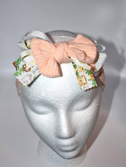 Add a splash of fun to your look with this wrapped headband featuring a super cute animal print ribbon blended with soft peach fabric. This one-of-a-kind piece is perfect for brightening your day and keeping hair stylishly in place. 🐾🍑✨