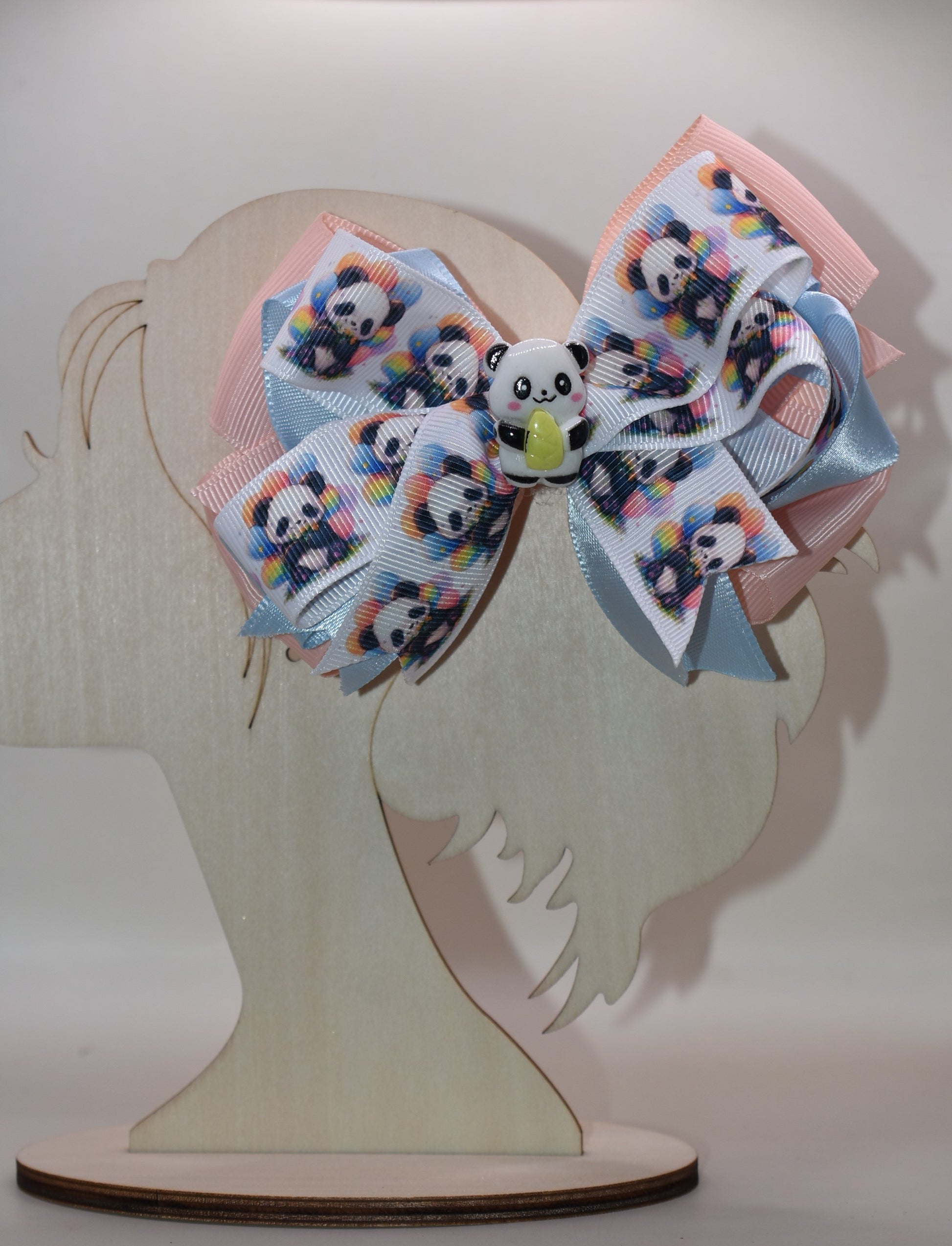 Meet your new favorite accessory! 🐼 This super cute panda bow features an adorable ribbon design with a charming little panda accent that'll have you smiling every time you wear it. The wrapped alligator clip makes styling effortless—just clip and go! ✨ Perfect for adding a playful touch to any hairstyle, this little cutie is impossible not to love. 💕 Get ready to turn heads with this sweet panda charm! 🎀