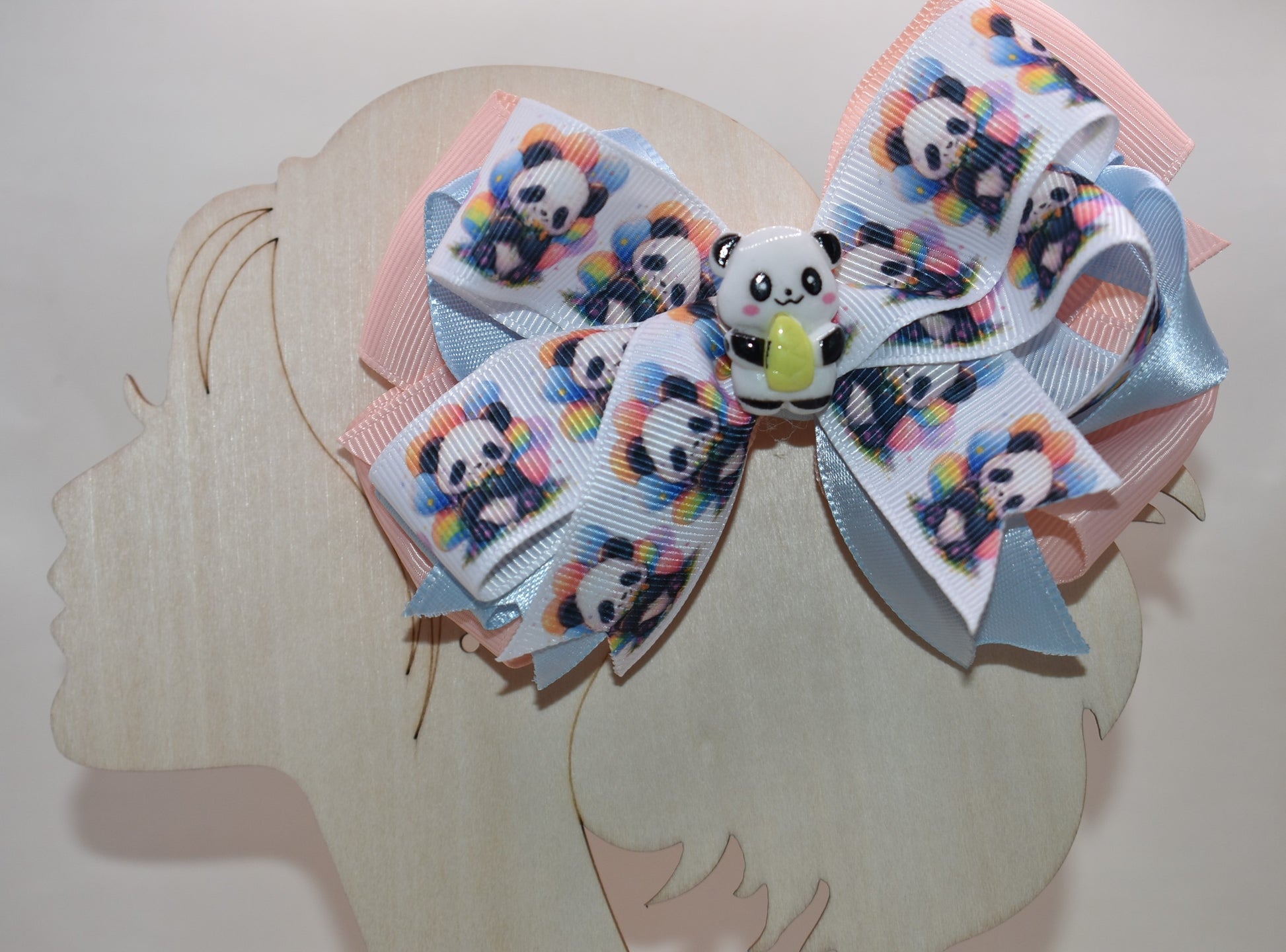 Meet your new favorite accessory! 🐼 This super cute panda bow features an adorable ribbon design with a charming little panda accent that'll have you smiling every time you wear it. The wrapped alligator clip makes styling effortless—just clip and go! ✨ Perfect for adding a playful touch to any hairstyle, this little cutie is impossible not to love. 💕 Get ready to turn heads with this sweet panda charm! 🎀
