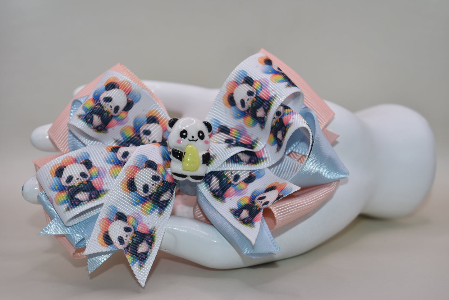 Meet your new favorite accessory! 🐼 This super cute panda bow features an adorable ribbon design with a charming little panda accent that'll have you smiling every time you wear it. The wrapped alligator clip makes styling effortless—just clip and go! ✨ Perfect for adding a playful touch to any hairstyle, this little cutie is impossible not to love. 💕 Get ready to turn heads with this sweet panda charm! 🎀