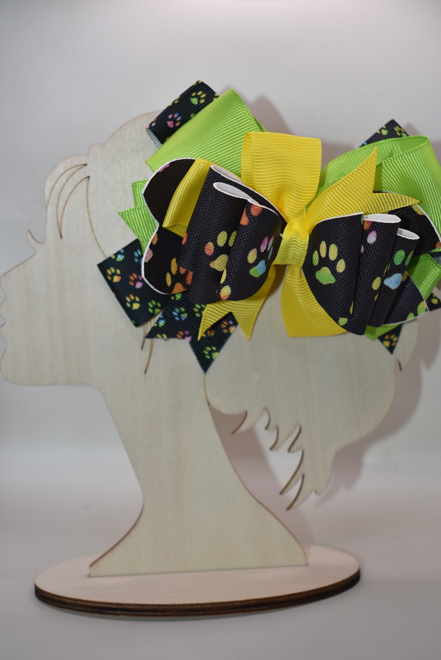 Adorable paw print faux leather bow featuring vibrant, mixed colors that pop! 🐾✨ This charming accessory pairs perfectly with any outfit and any vibe you're going for. The wrapped alligator clip makes it super easy to clip and go, so you can switch up your look in seconds. 🎀 Whether you're dressing up or keeping it casual, this cute bow adds that perfect finishing touch! 💕