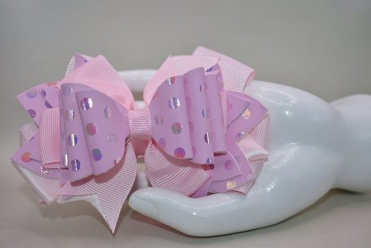 Get ready to turn heads with this adorable pink bow that's pure charm! 🎀 Layered with mixed ribbons and luxe faux leather, it features a shimmering polka dot design that adds the perfect pop to any outfit. ✨ The wrapped alligator clip makes it super easy to clip on and off whenever you want. Pretty in pink has never looked so good! 💕