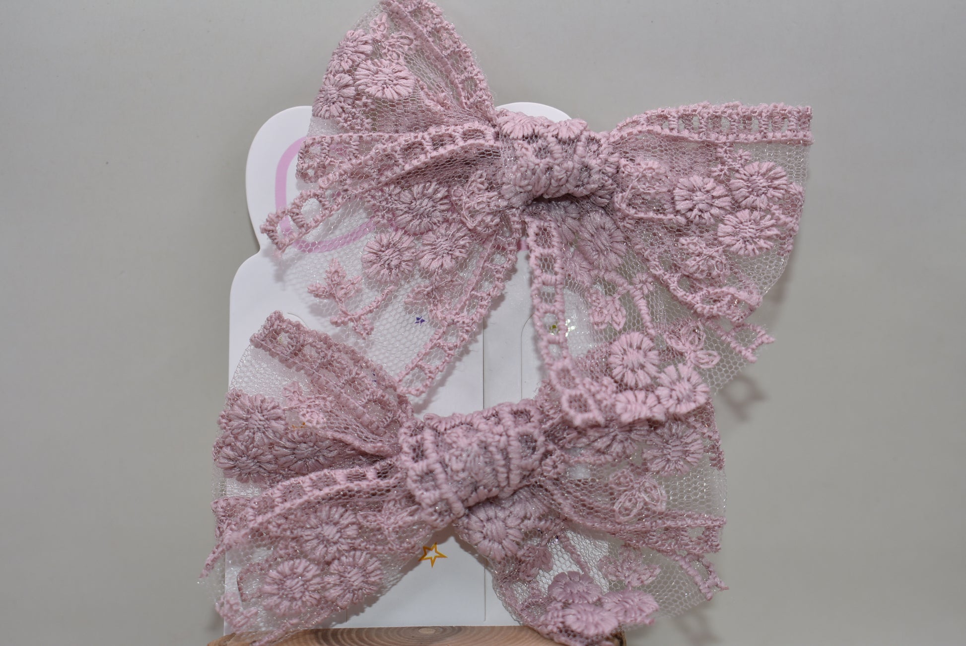 Adorable light mauve lace bows that bring a touch of elegance and whimsy to any look! This charming set of 2 features delicate lace detailing in a soft, romantic mauve shade—perfect for hair styling, gift wrapping, or adding a sweet accent to your favorite accessories. Whether you're dressing up for a special occasion or just want to add a little feminine flair to your everyday style, these bows are sure to make you smile. Versatile, lovely, and oh-so-pretty!