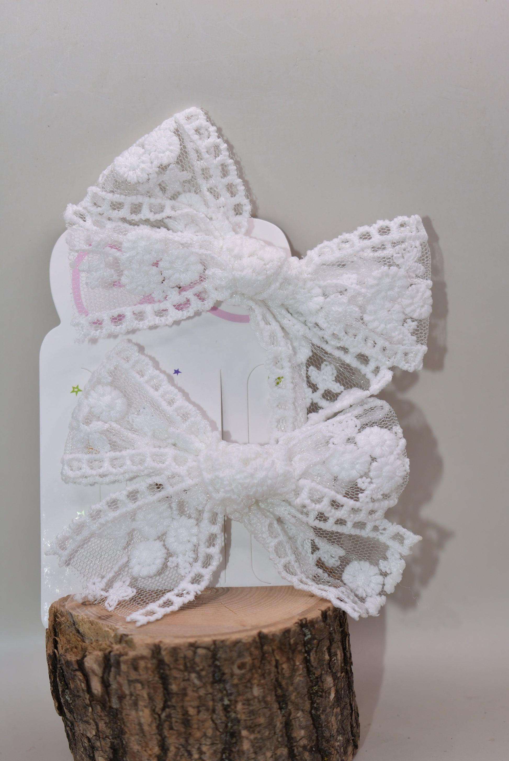 Elevate your style with these charming white lace bows—a delightful duo perfect for adding a touch of elegance to any look. Whether you're styling your hair, accessorizing a gift, or decorating a special occasion, these intricate lace beauties bring sophistication and whimsy in equal measure. Versatile, timeless, and oh-so-lovely, this set of 2 is your go-to for creating picture-perfect moments with effortless grace.