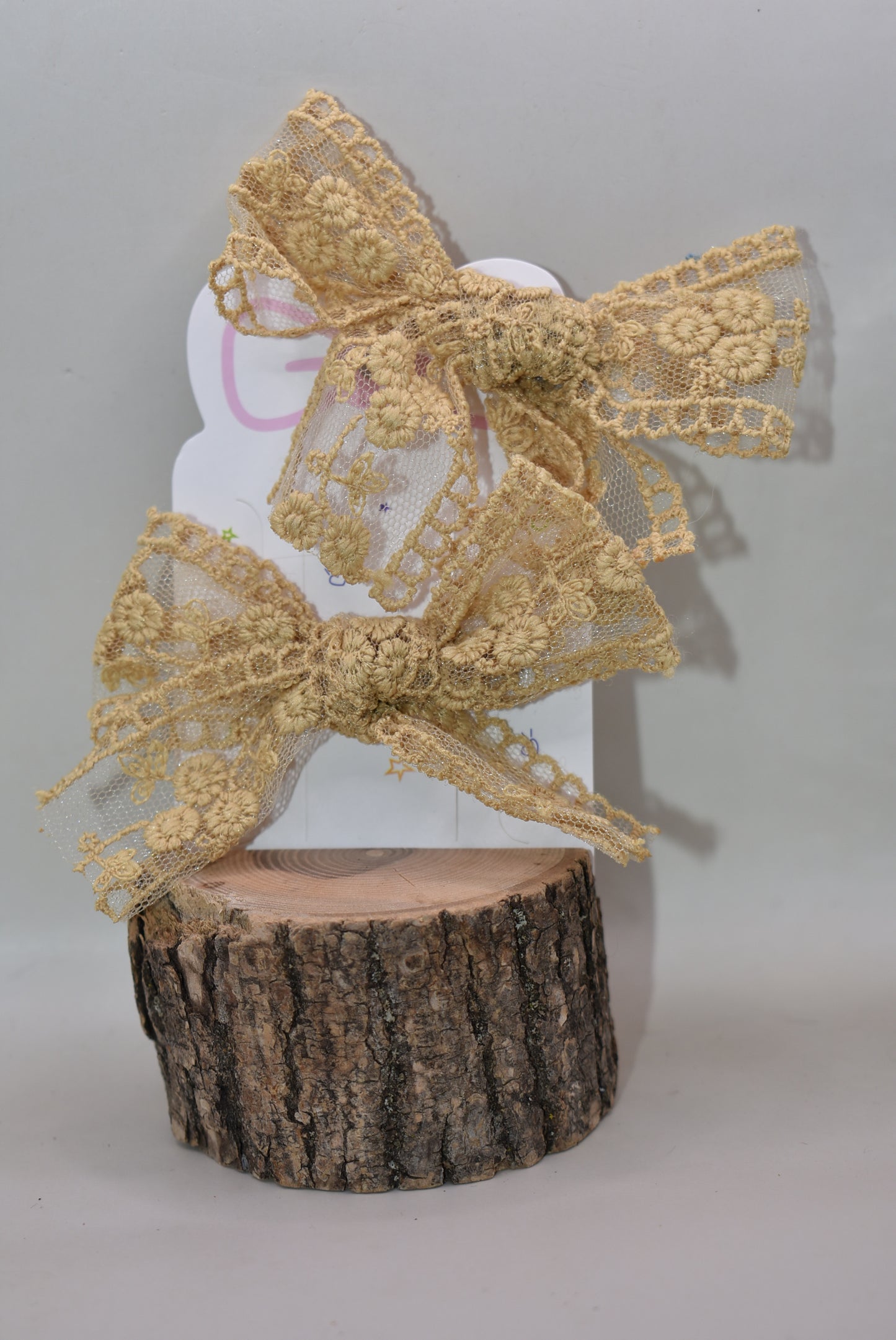 Elevate your accessory game with these stunning gold lace bows! This charming set of two brings instant elegance to any hairstyle, outfit, or creative project. Crafted with delicate lace detailing and a luxe gold finish, they're perfect for adding a touch of sophistication to everyday looks or special occasions. Whether you're styling up for a night out or adding flair to a gift, these versatile bows deliver major charm in a petite package. Double the bows, double the fun!