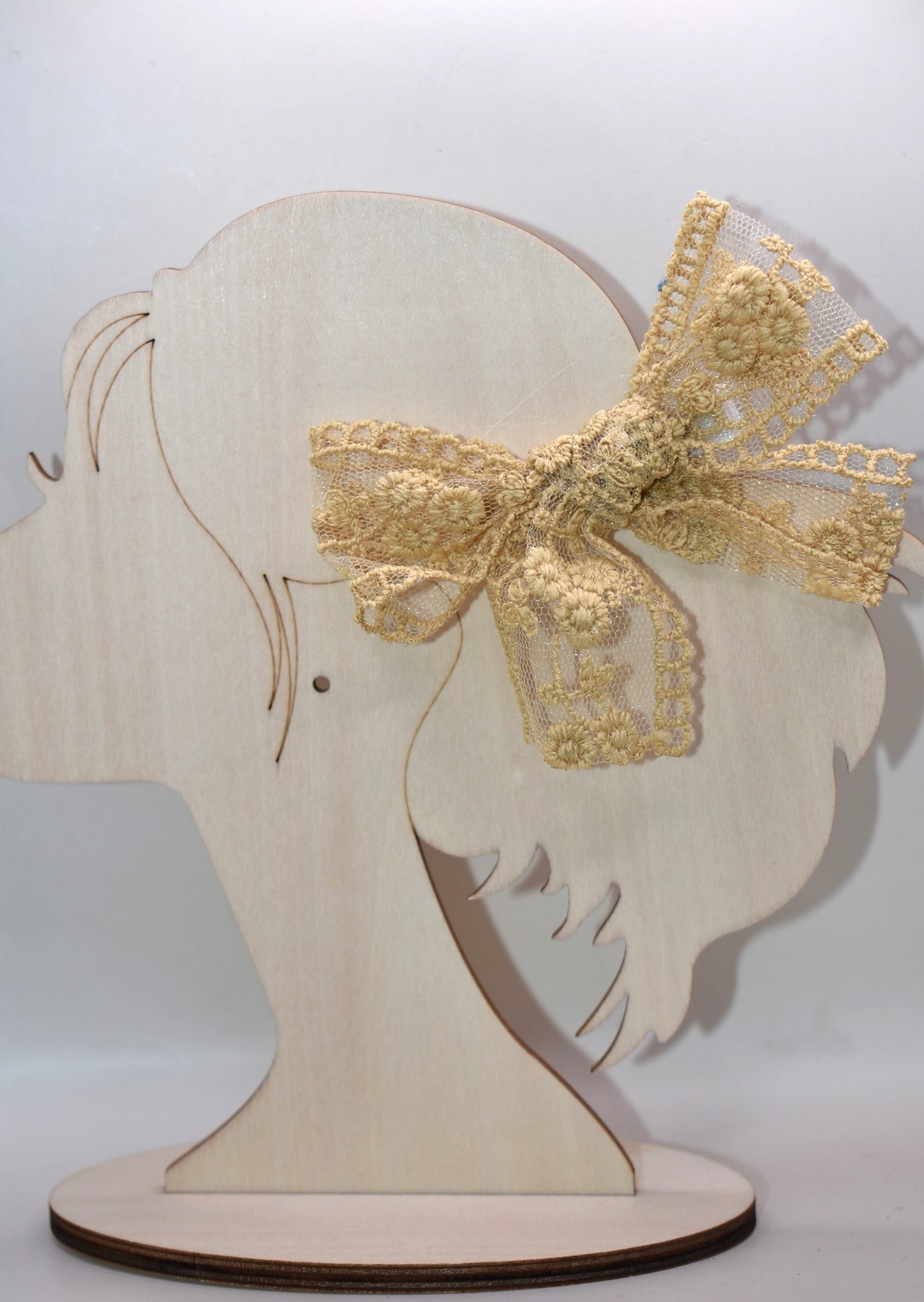 Elevate your accessory game with these stunning gold lace bows! This charming set of two brings instant elegance to any hairstyle, outfit, or creative project. Crafted with delicate lace detailing and a luxe gold finish, they're perfect for adding a touch of sophistication to everyday looks or special occasions. Whether you're styling up for a night out or adding flair to a gift, these versatile bows deliver major charm in a petite package. Double the bows, double the fun!