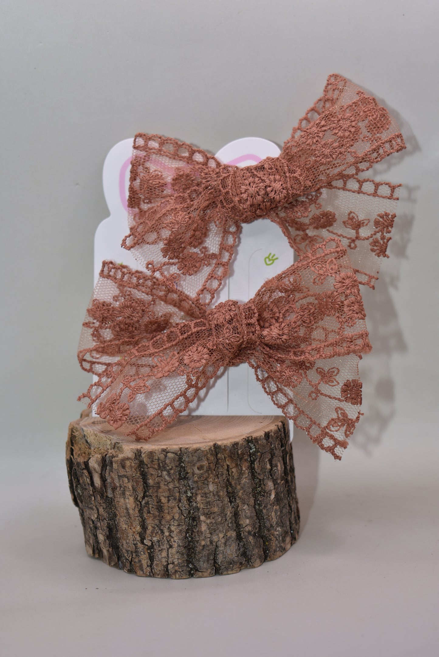 Elevate your style with this charming duo of rust-colored lace bows! Perfect for adding a touch of vintage-inspired elegance to any outfit, these delicate bows feature intricate lace detailing that catches the eye. Whether you're styling your hair, accessorizing a gift, or decorating a special project, this set of two offers versatile charm. The warm rust hue pairs beautifully with both neutral and bold palettes, making these bows a go-to accessory for any occasion. Sweet, sophisticated, and endlessly fun!