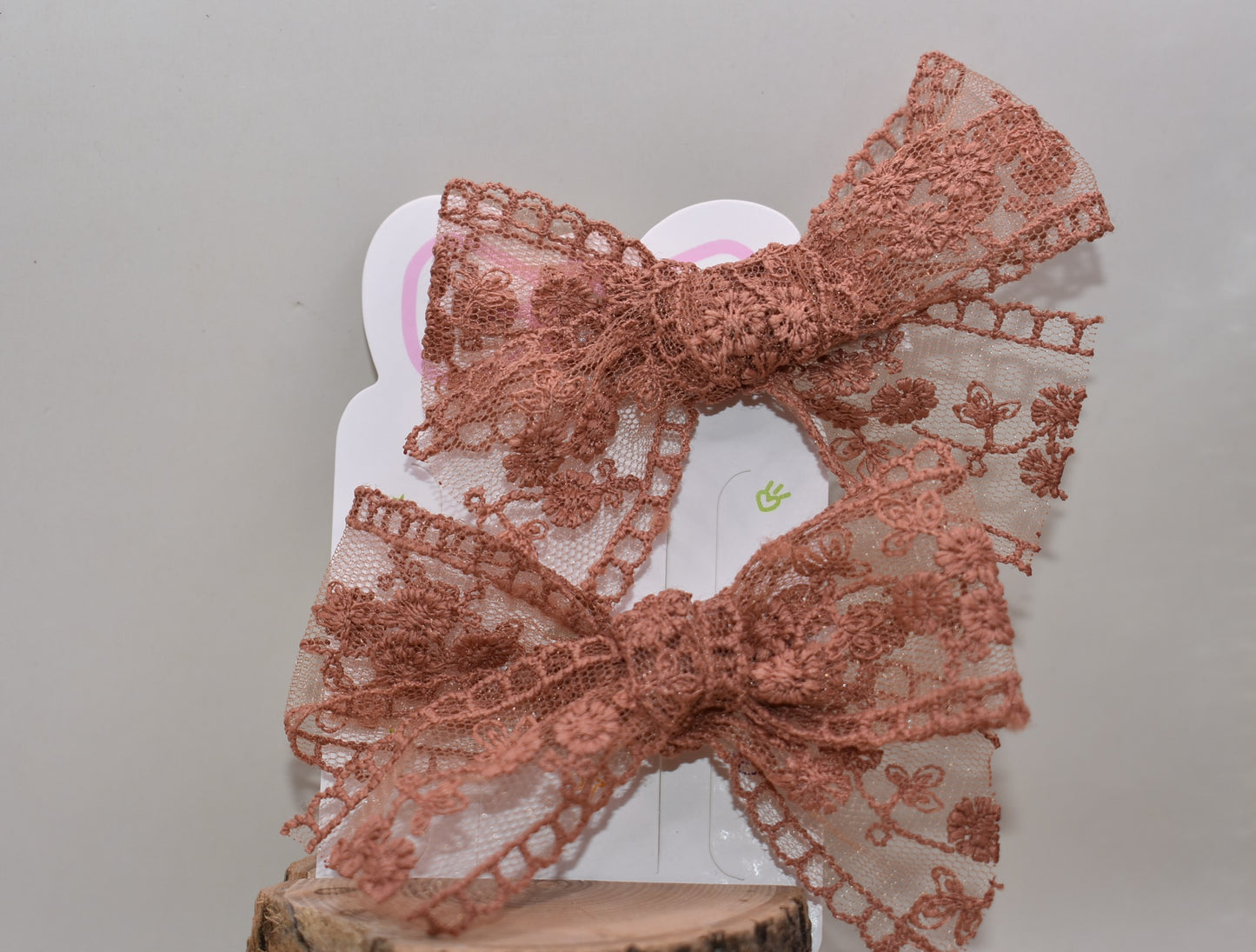 Elevate your style with this charming duo of rust-colored lace bows! Perfect for adding a touch of vintage-inspired elegance to any outfit, these delicate bows feature intricate lace detailing that catches the eye. Whether you're styling your hair, accessorizing a gift, or decorating a special project, this set of two offers versatile charm. The warm rust hue pairs beautifully with both neutral and bold palettes, making these bows a go-to accessory for any occasion. Sweet, sophisticated, and endlessly fun!