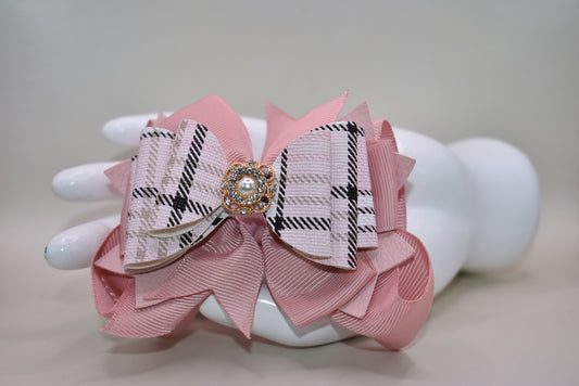 ✨ This charming bow brings instant elegance to any hairstyle! Featuring a gorgeous blush and black mixed plaid faux leather design with delicate ribbon layers underneath, it's topped with a sparkly gem and pearl charm for that extra touch of glamour. ✨ The secure alligator clip keeps it perfectly in place all day long. Whether you're dressing up for a special occasion or adding flair to your everyday look, this bow works beautifully for everyone—from the young at heart to the young at style! 🎀💕