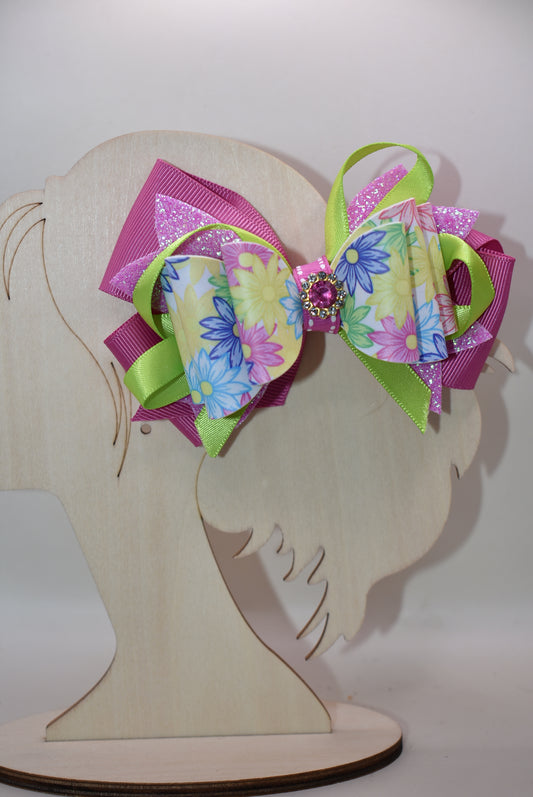 ✨ Get ready to turn heads with this absolutely gorgeous pink floral bow! 🌸 Featuring layers upon layers of silky ribbon for that full, fabulous look, this beauty is topped with a sparkling pink crystal charm that catches the light just right. 💎 The wrapped alligator clip on the back keeps everything secure and comfy all day long, so you can rock this charming accessory without a worry. Perfect for adding a touch of elegance and sparkle to any hairstyle! 🎀