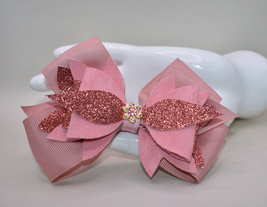 ✨ Meet your new go-to accessory! This one-of-a-kind bow blends rose gold faux leather and suede with delicate ribbon details, topped with an adorable charm that steals the show. 🎀 The perfect mix of shiny and soft textures makes it versatile enough to dress up any outfit—whether you're going casual or glam. 💕 Looking for something different? This is it! 🌹