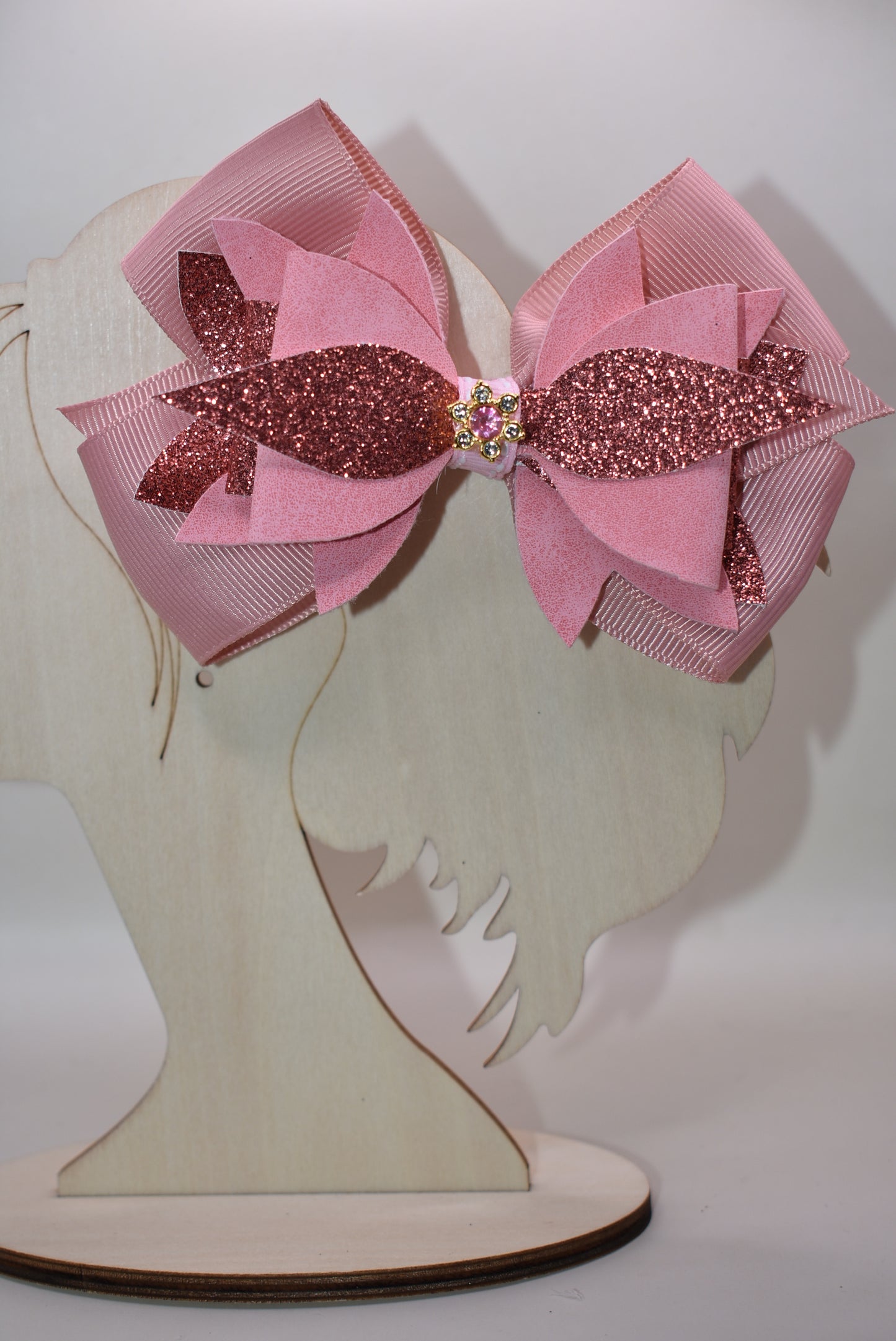 ✨ Meet your new go-to accessory! This one-of-a-kind bow blends rose gold faux leather and suede with delicate ribbon details, topped with an adorable charm that steals the show. 🎀 The perfect mix of shiny and soft textures makes it versatile enough to dress up any outfit—whether you're going casual or glam. 💕 Looking for something different? This is it! 🌹