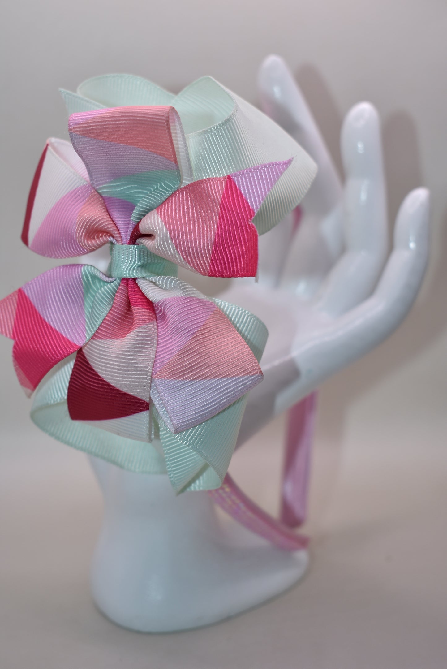 ✨ Step into style with this charming multi-colored headband that brings a pop of personality to any look! Featuring gorgeous pastel hues beautifully blended together and finished with a delicate pink sparkle accent on soft satin, this headband is as pretty as it is practical. The flexible design ensures all-day comfort, whether you're running errands, heading to an event, or just keeping your hair in place with flair. 🎀 Perfect for adding that extra touch of whimsy to your everyday style! 💕