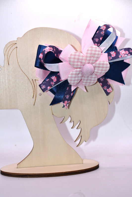 Get ready to spring into style with this one-of-a-kind bow! 🌸 Layers upon layers of gorgeous ribbon create dimension and movement, while an adorable checkered flower sits pretty on top for that perfect finishing touch. ✨ The wrapped alligator clip makes it effortless to wear—just clip and go! 🎀 This charming accessory is sure to have you falling head over heels. 💕