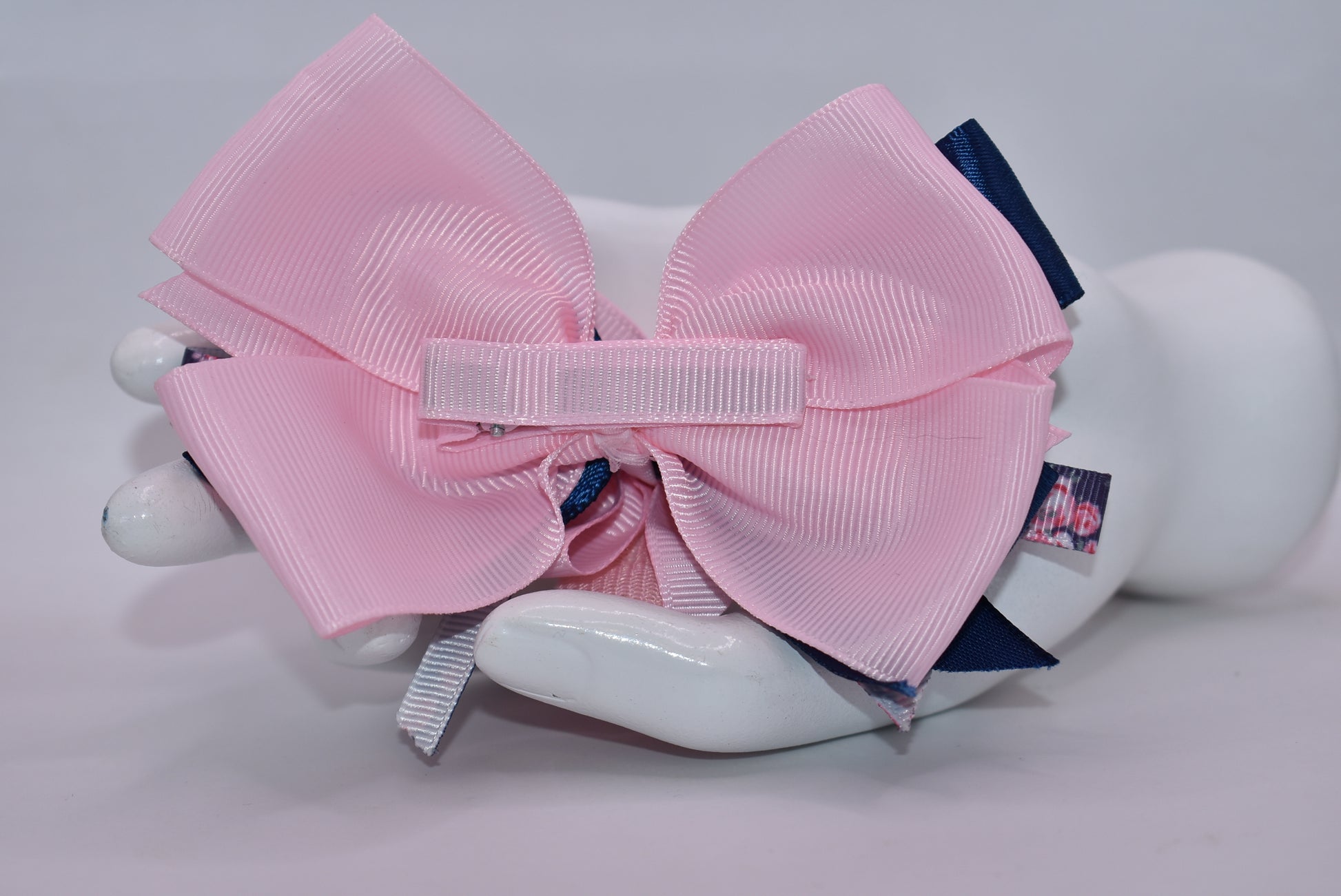 Get ready to spring into style with this one-of-a-kind bow! 🌸 Layers upon layers of gorgeous ribbon create dimension and movement, while an adorable checkered flower sits pretty on top for that perfect finishing touch. ✨ The wrapped alligator clip makes it effortless to wear—just clip and go! 🎀 This charming accessory is sure to have you falling head over heels. 💕
