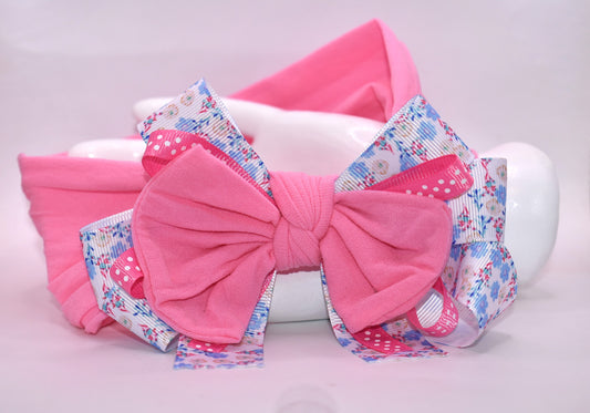 🎀 Elevate your everyday look with this charming wrapped headband featuring a gorgeous blue and pink floral ribbon design! 🌸 The stretchy nylon band adapts to fit all head sizes comfortably, making it the perfect accessory for any outfit—whether you're dressing up or keeping it casual. 💕 Add a pop of color and personality to your style with this versatile must-have! ✨