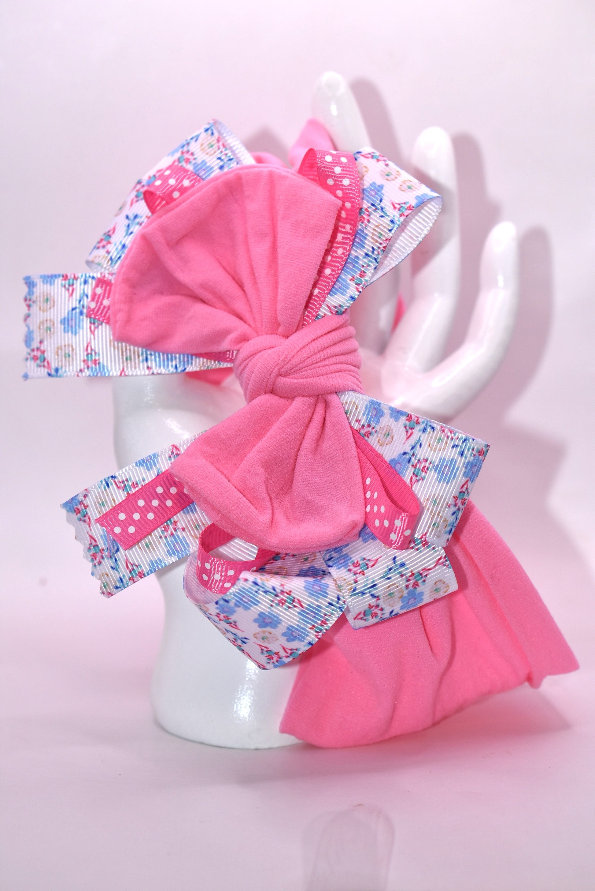 🎀 Elevate your everyday look with this charming wrapped headband featuring a gorgeous blue and pink floral ribbon design! 🌸 The stretchy nylon band adapts to fit all head sizes comfortably, making it the perfect accessory for any outfit—whether you're dressing up or keeping it casual. 💕 Add a pop of color and personality to your style with this versatile must-have! ✨